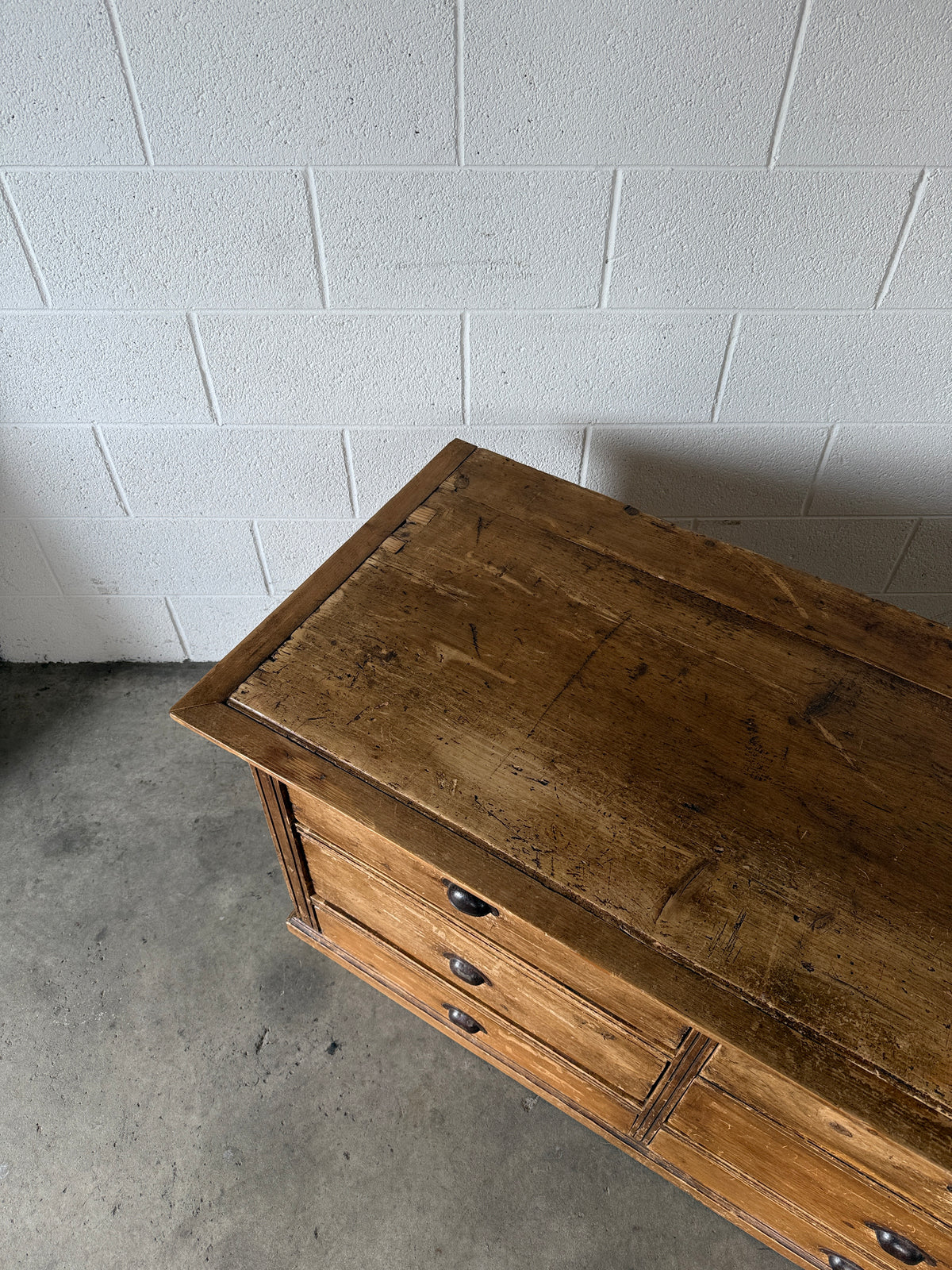 Low bank of 9 antique European drawers