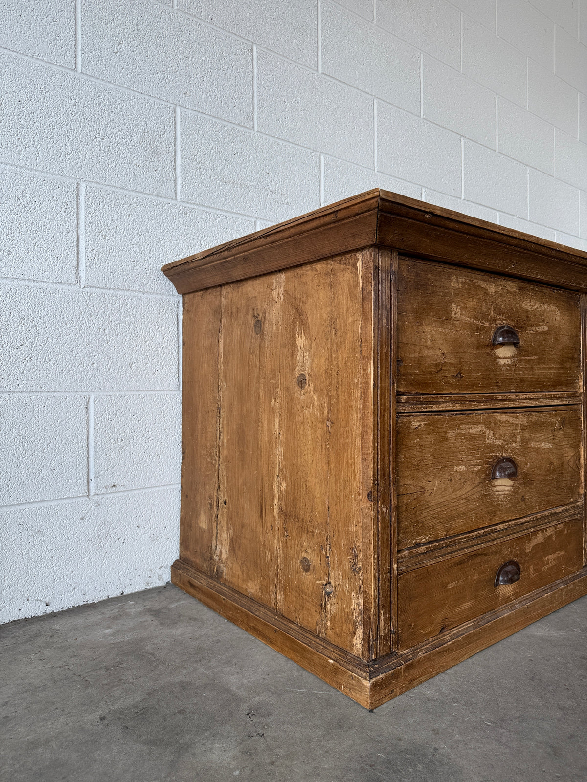 Low bank of 9 antique European drawers