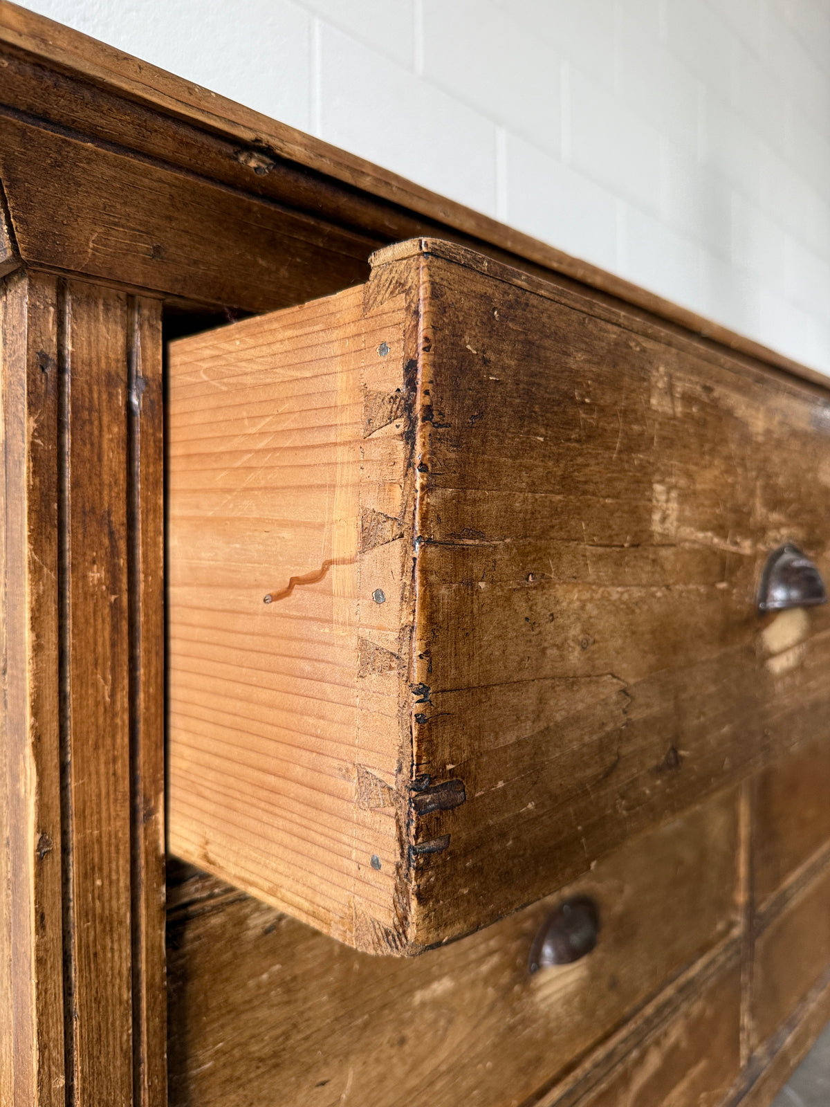 Low bank of 9 antique European drawers