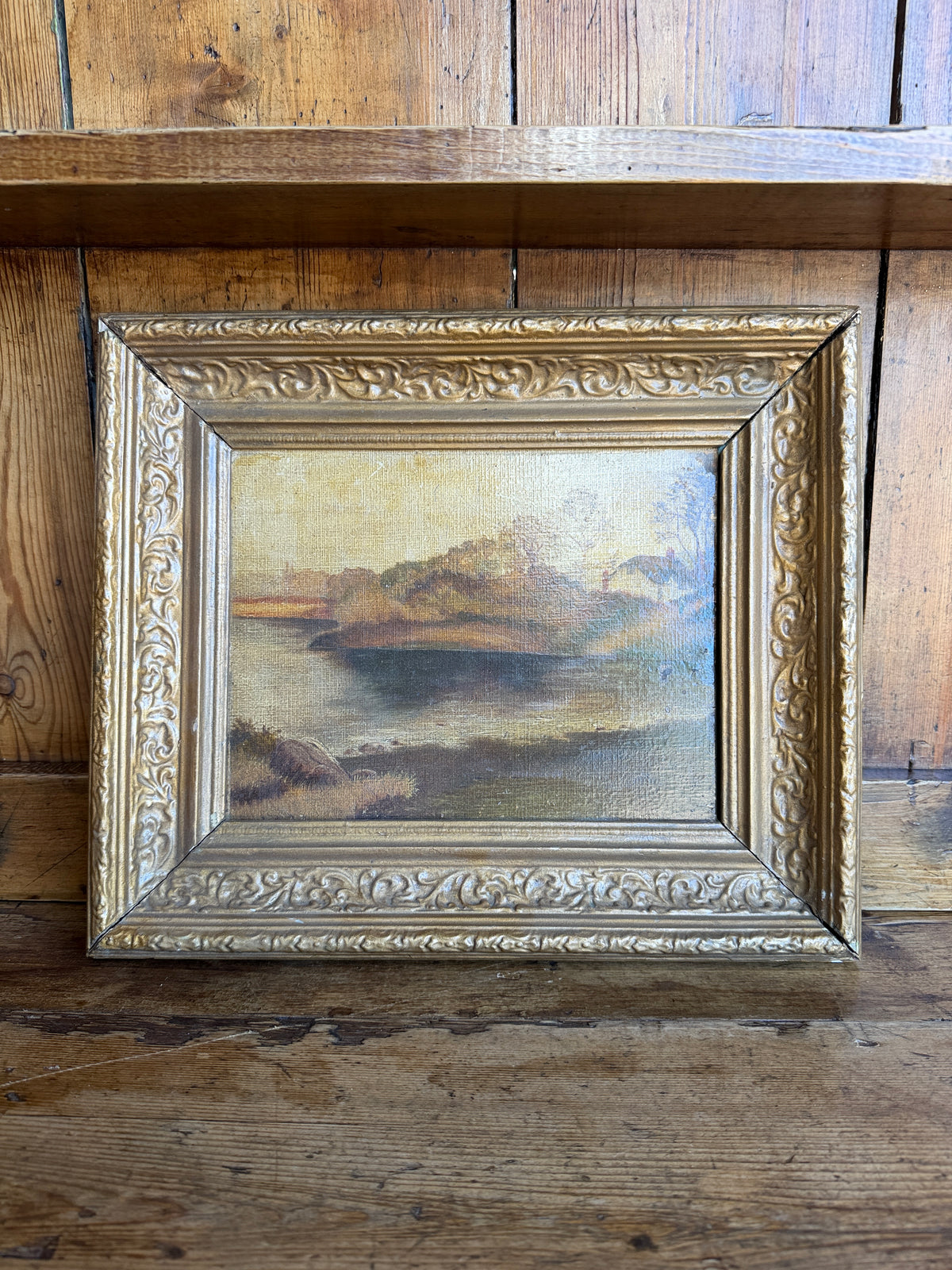 Antique landscape in wooden frame