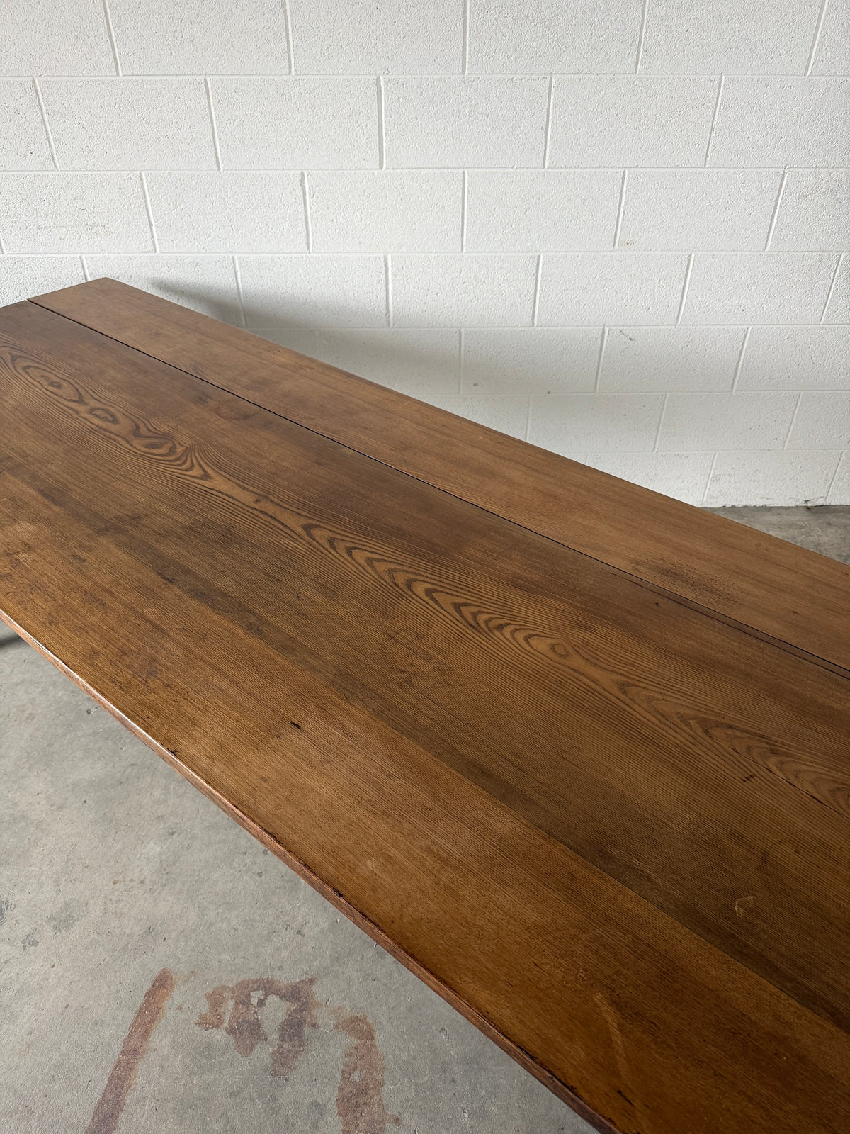 Victorian pine dining table with dark finish