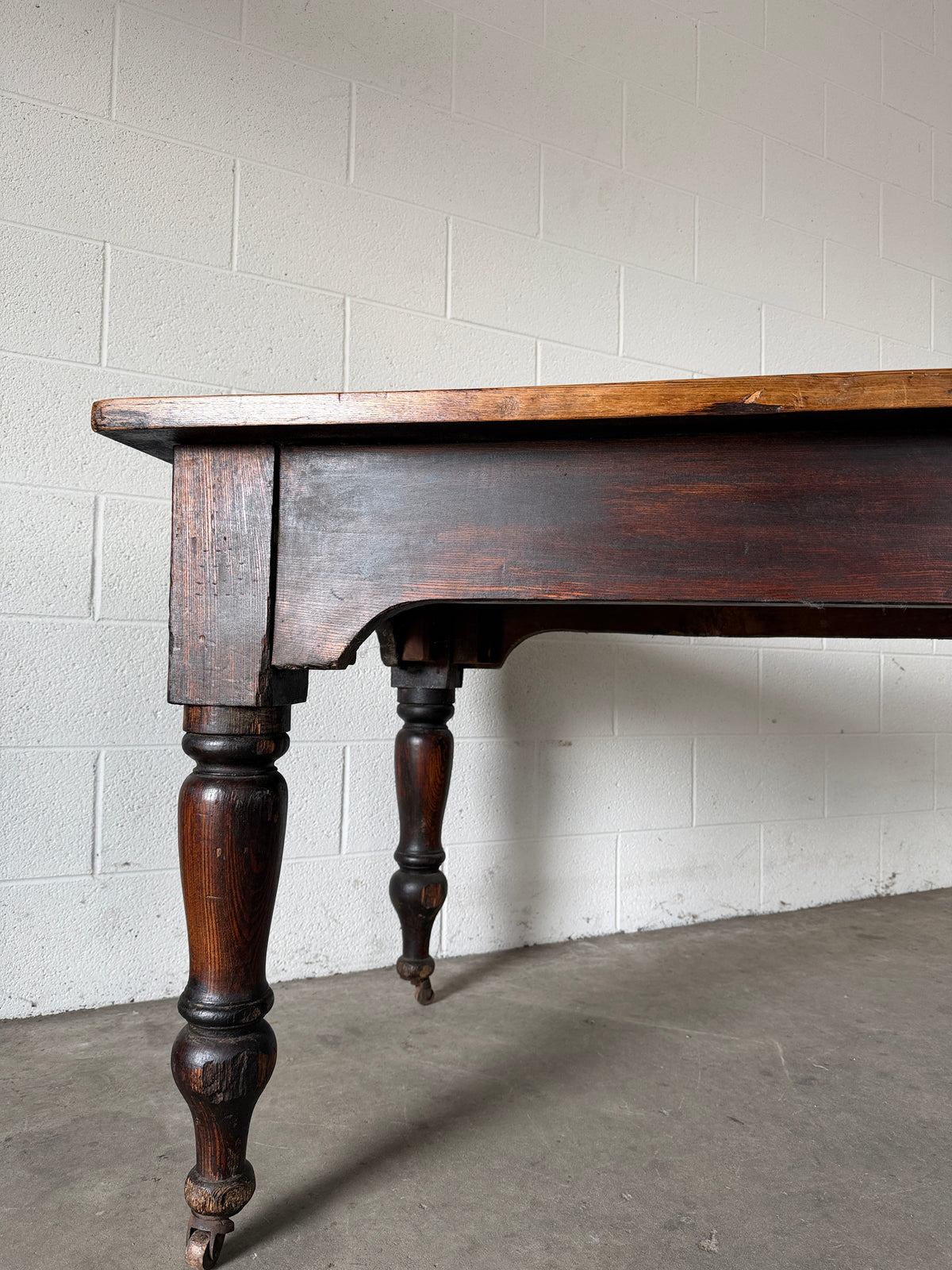 Victorian pine dining table with dark finish