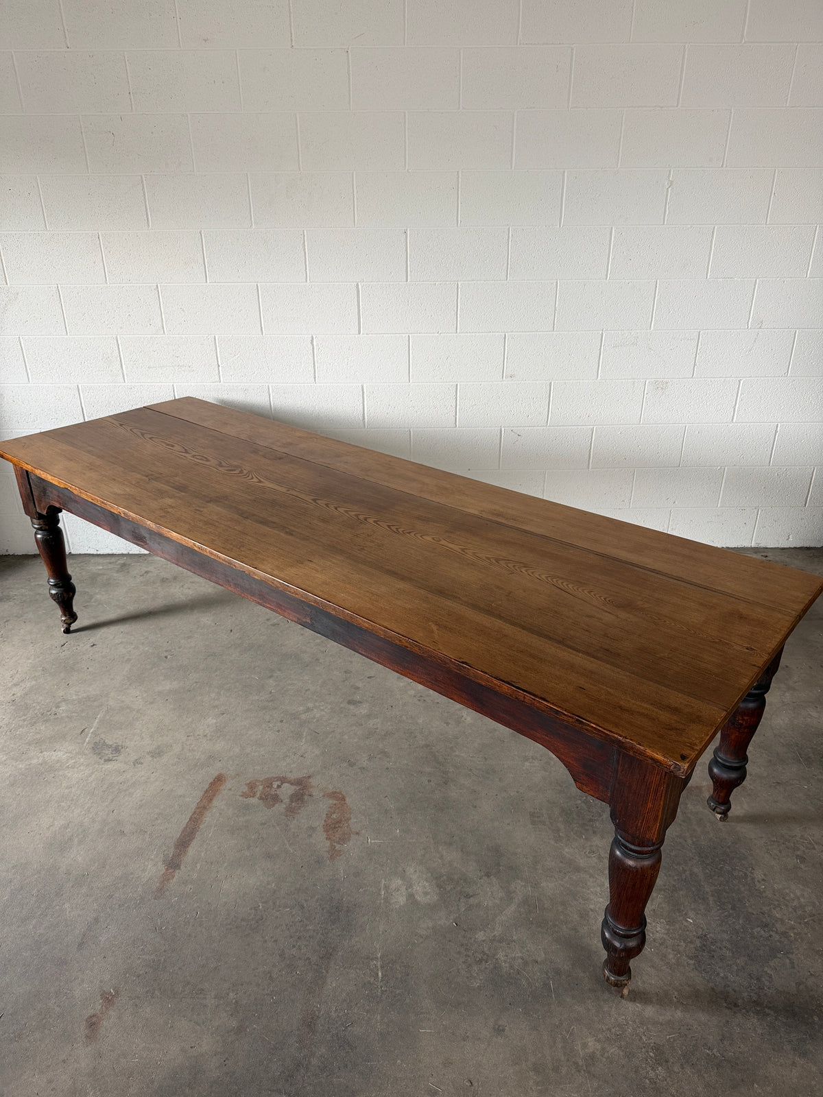 Victorian pine dining table with dark finish