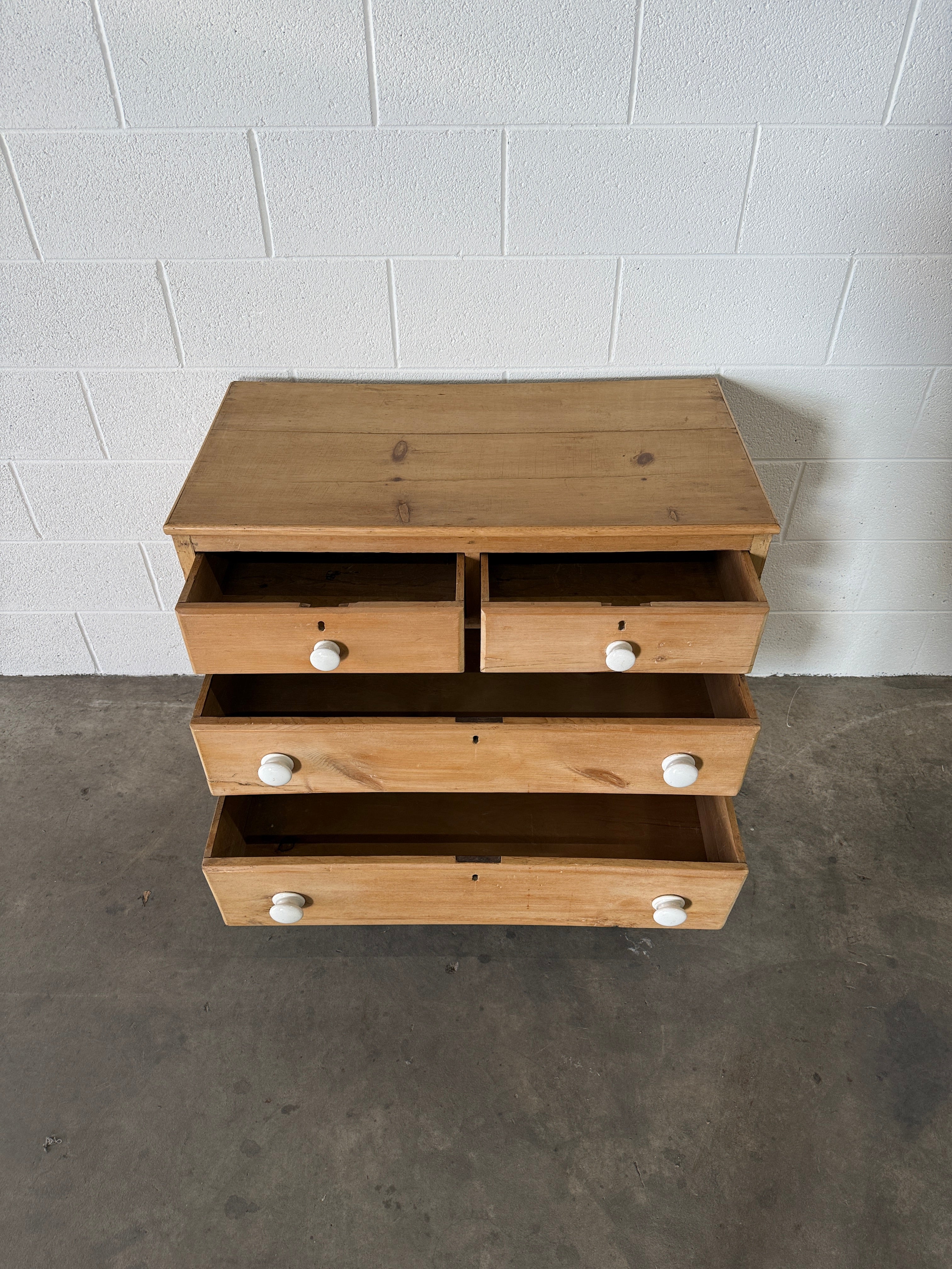 Petite pine chest of drawers with original porcelain knobs
