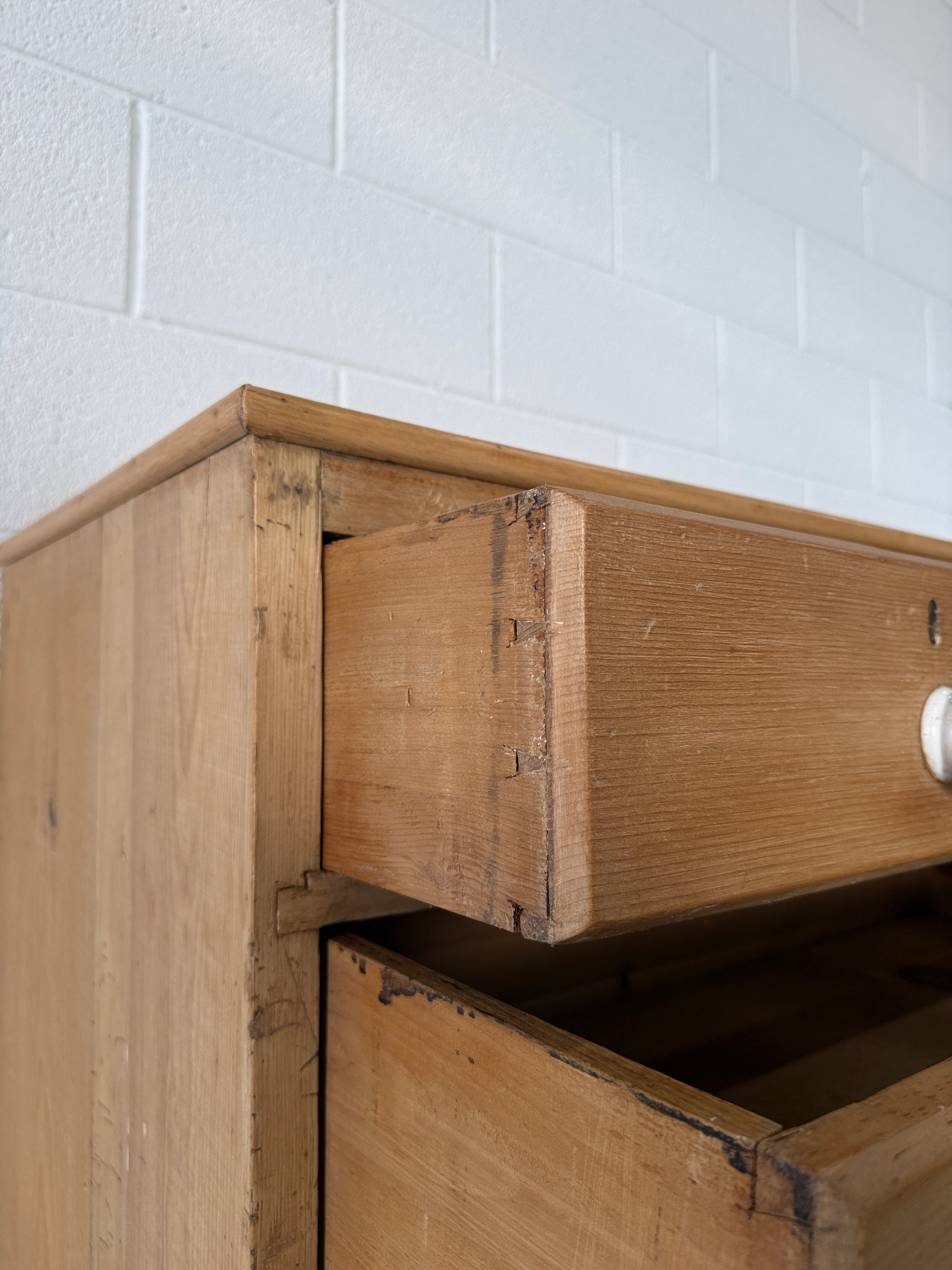 Petite pine chest of drawers with original porcelain knobs