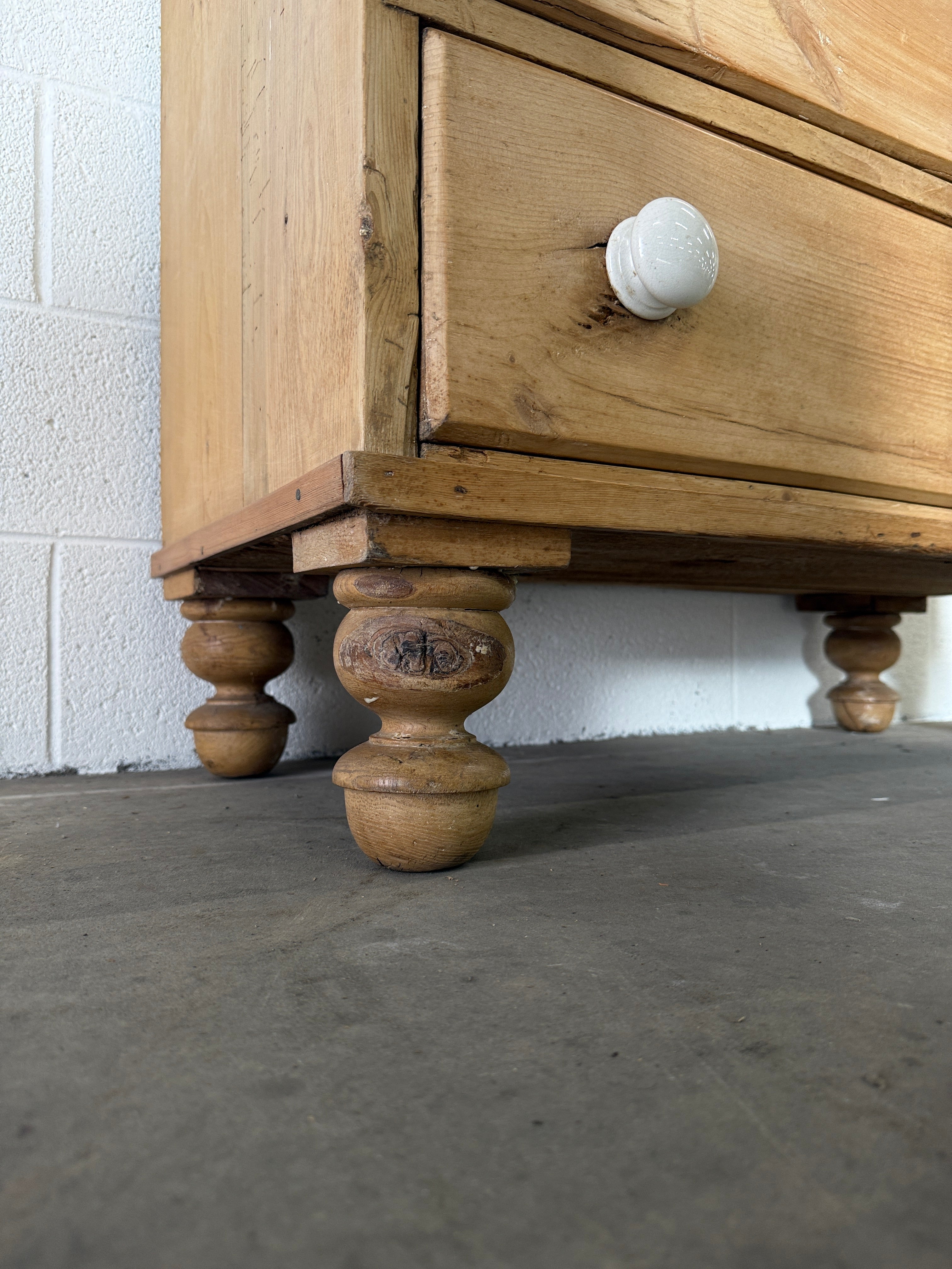 Petite pine chest of drawers with original porcelain knobs