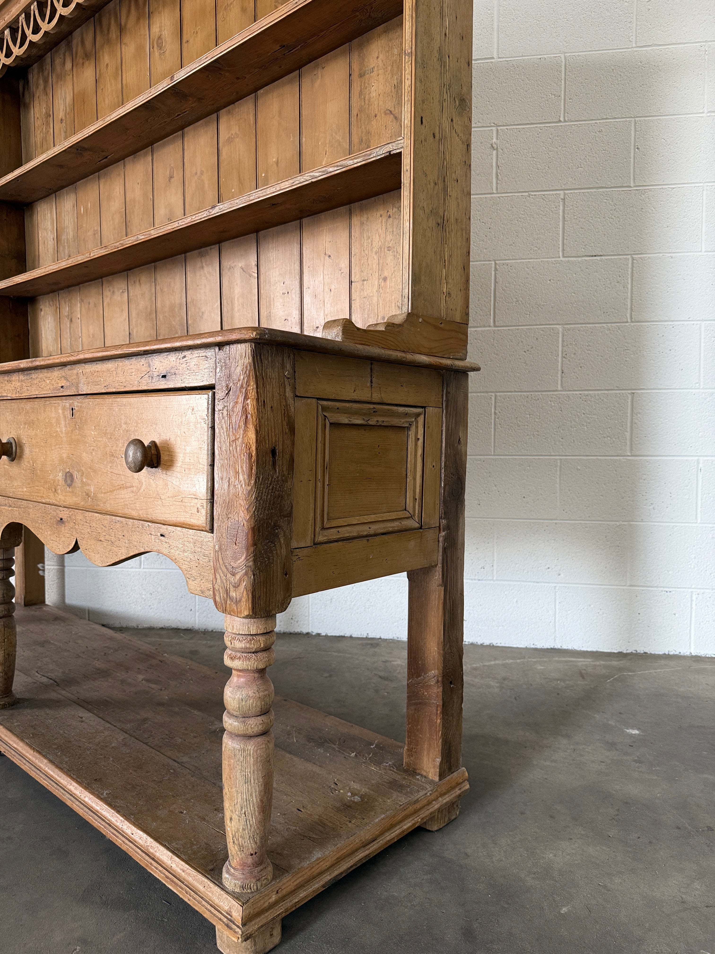 Antique pine kitchen dresser with decorative top