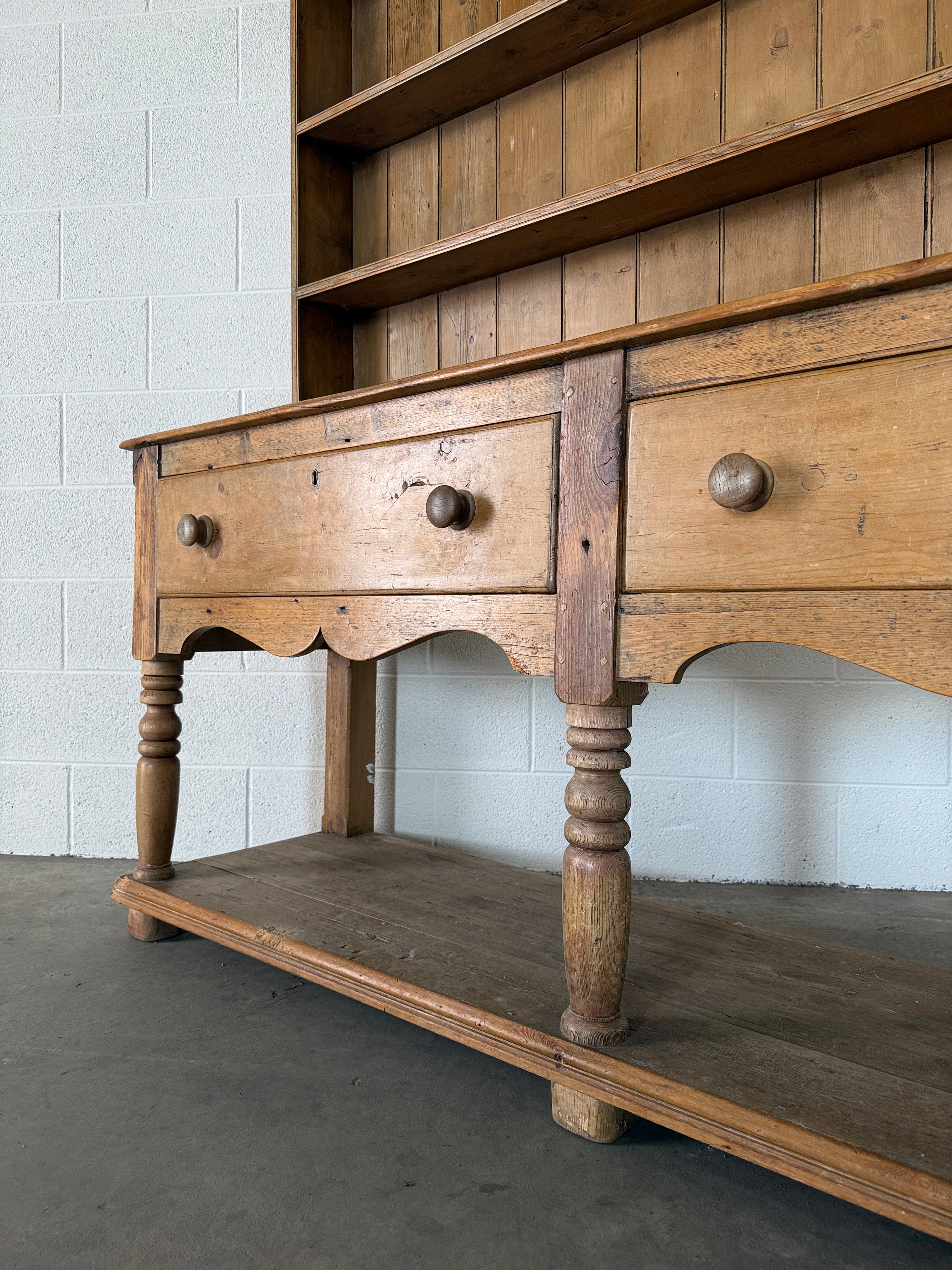 Antique pine kitchen dresser with decorative top