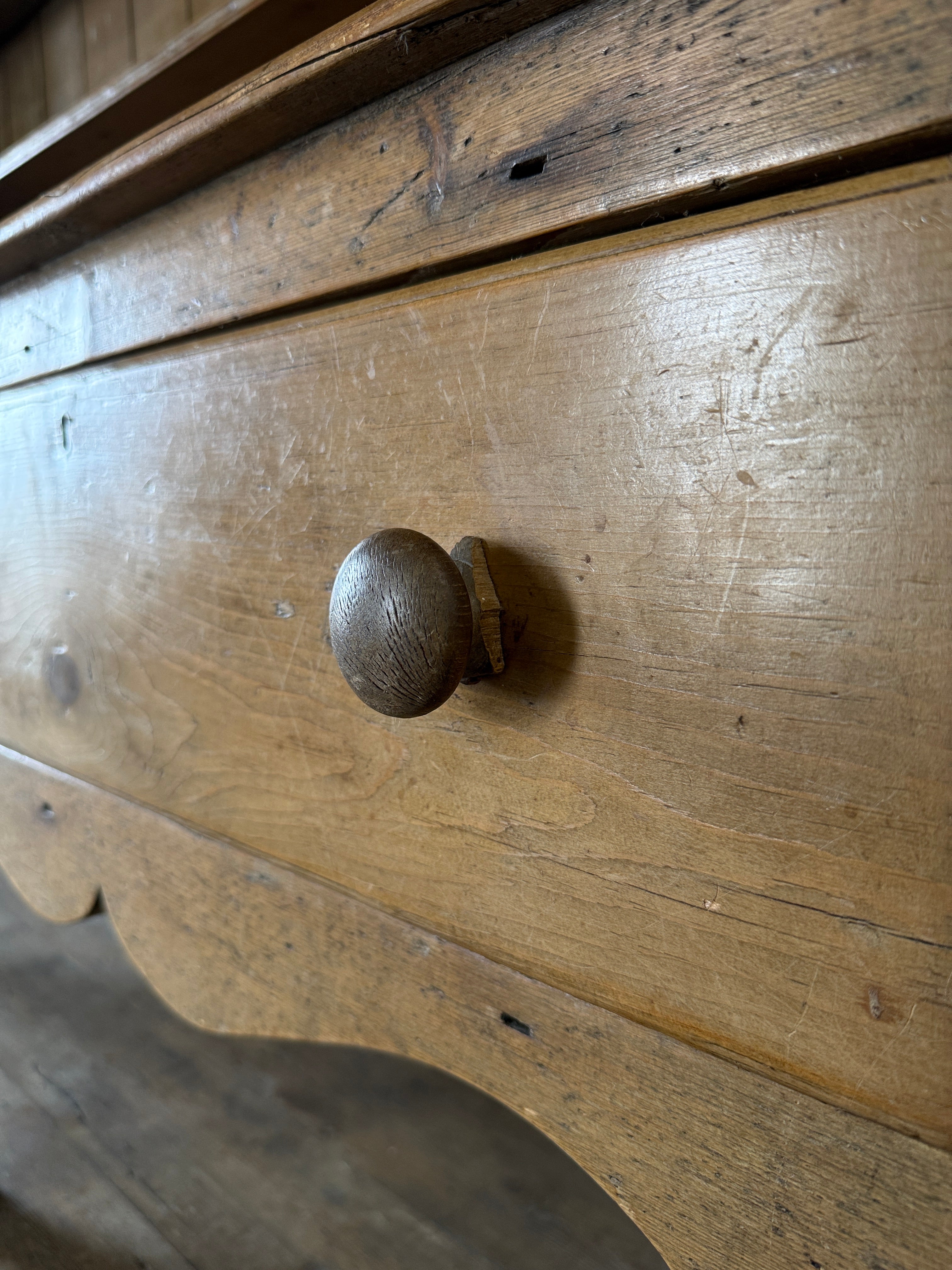 Antique pine kitchen dresser with decorative top