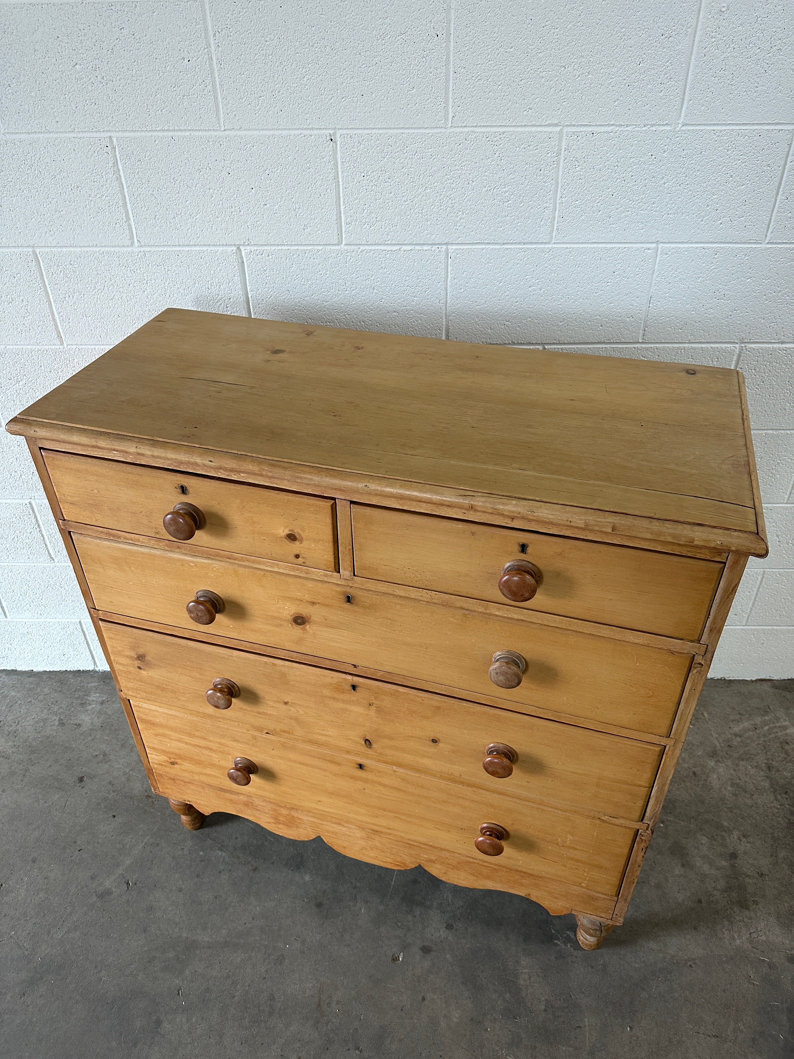 Tall English pine drawers with a scalloped apron