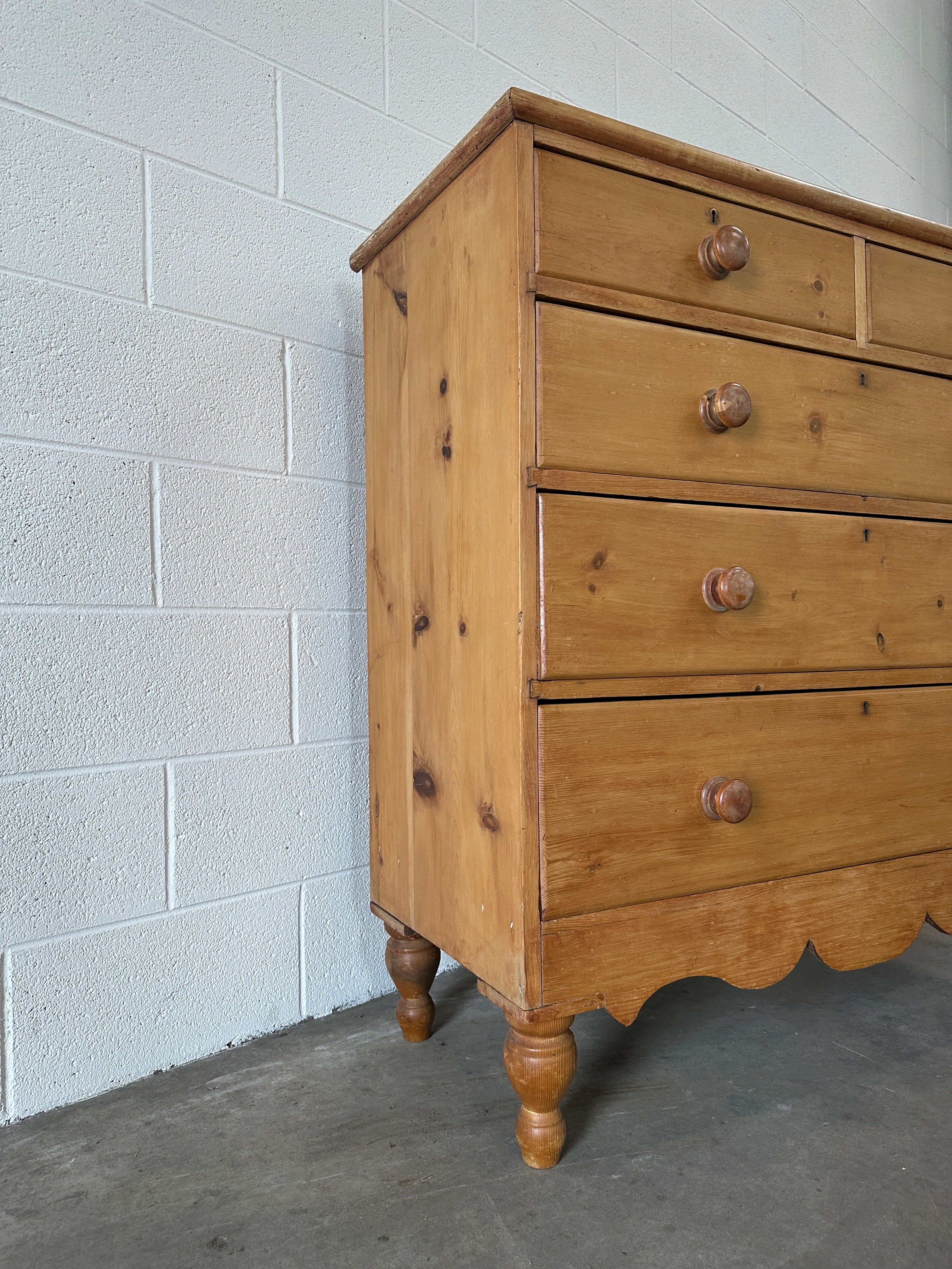 Tall English pine drawers with a scalloped apron