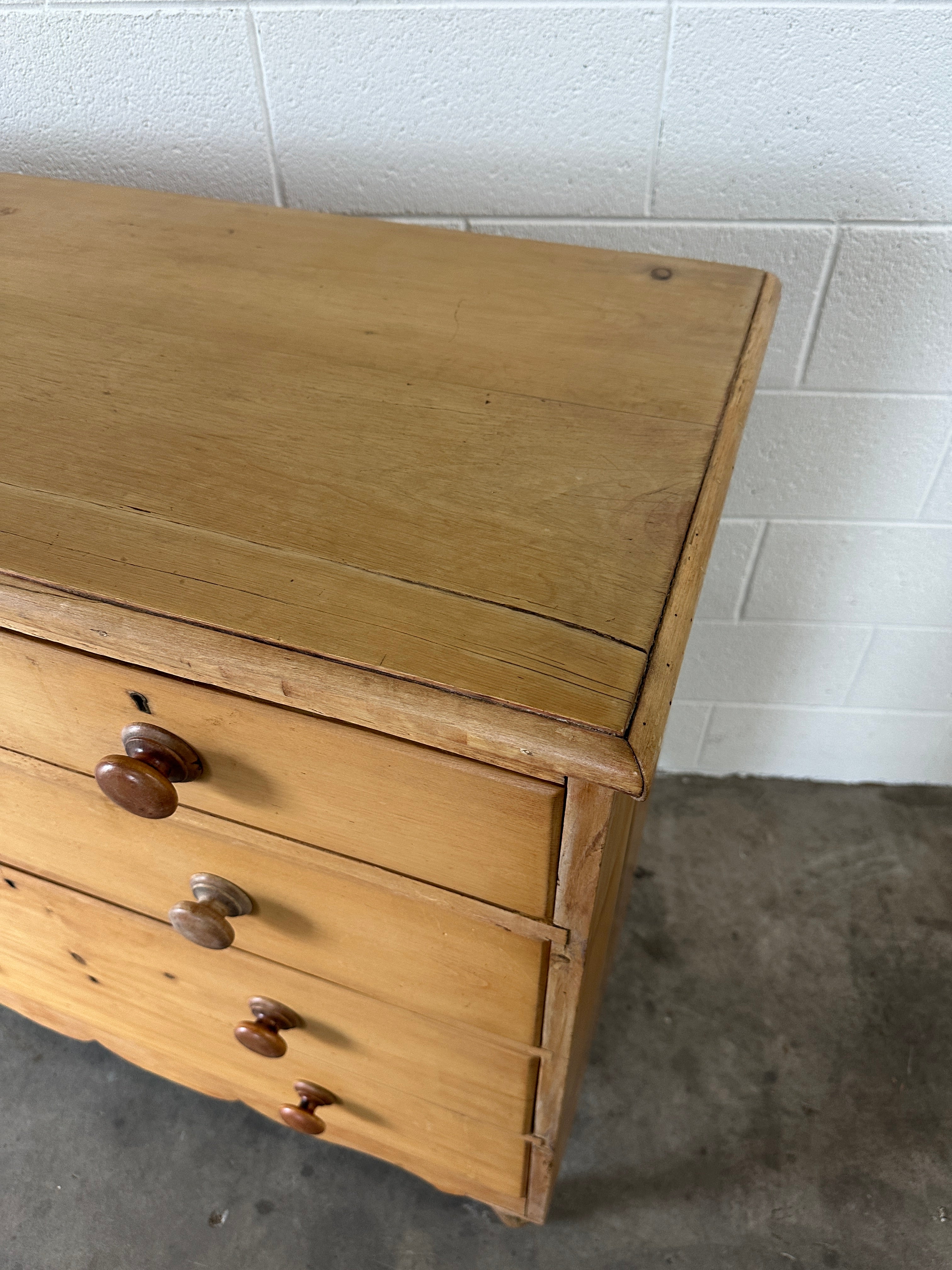 Tall English pine drawers with a scalloped apron