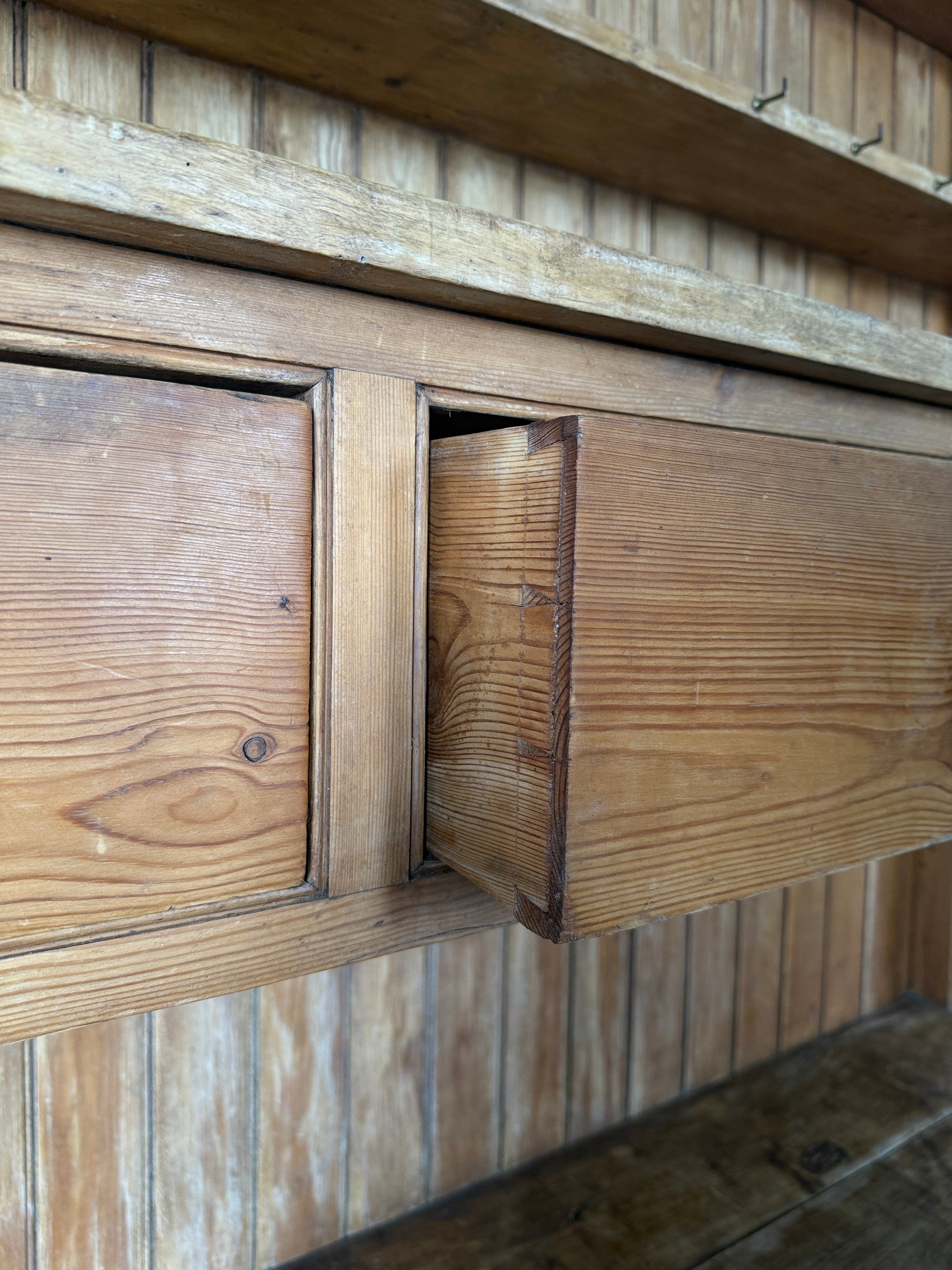 Simple antique English pine kitchen dresser with potboard base