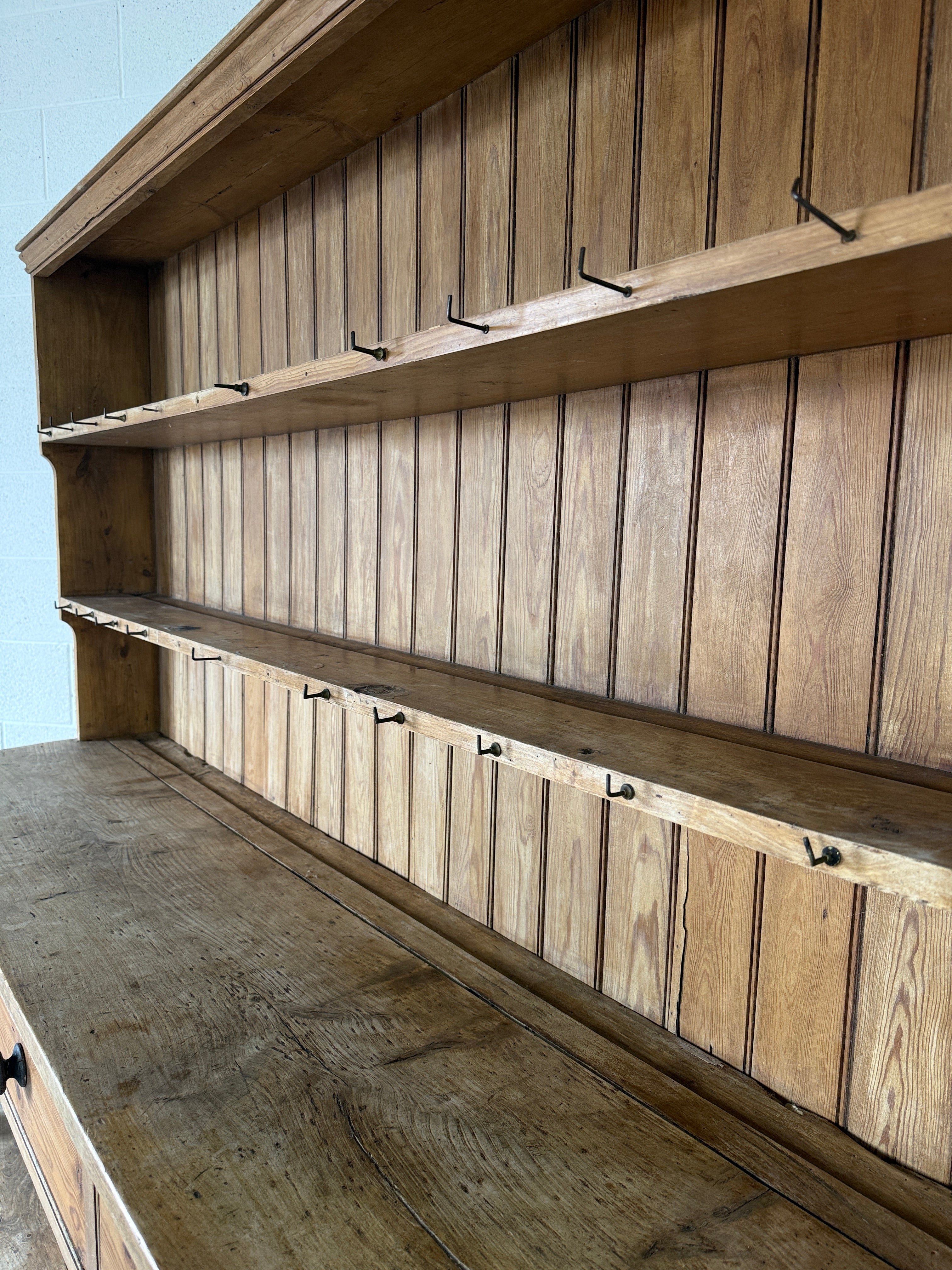 Simple antique English pine kitchen dresser with potboard base