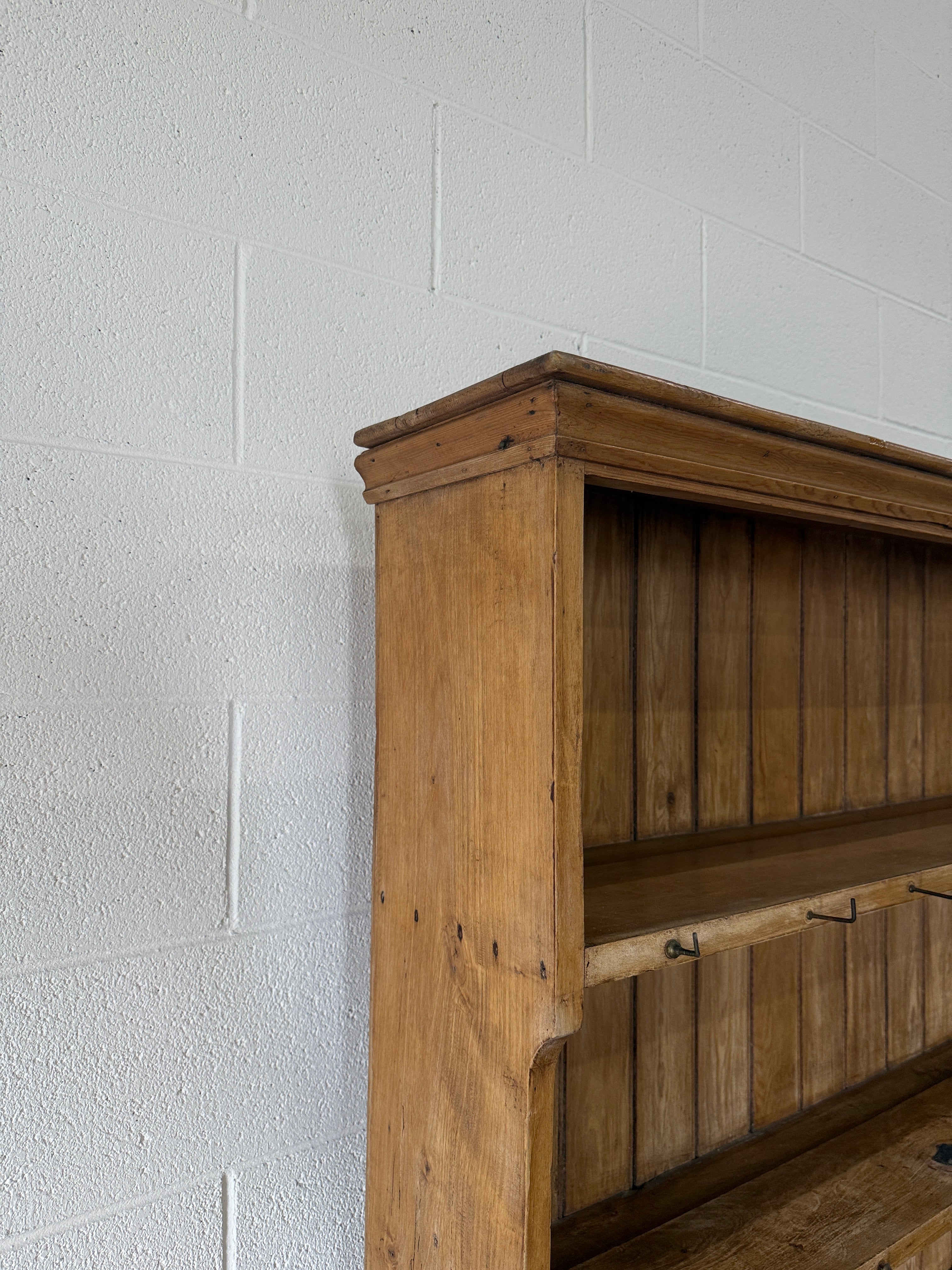 Simple antique English pine kitchen dresser with potboard base