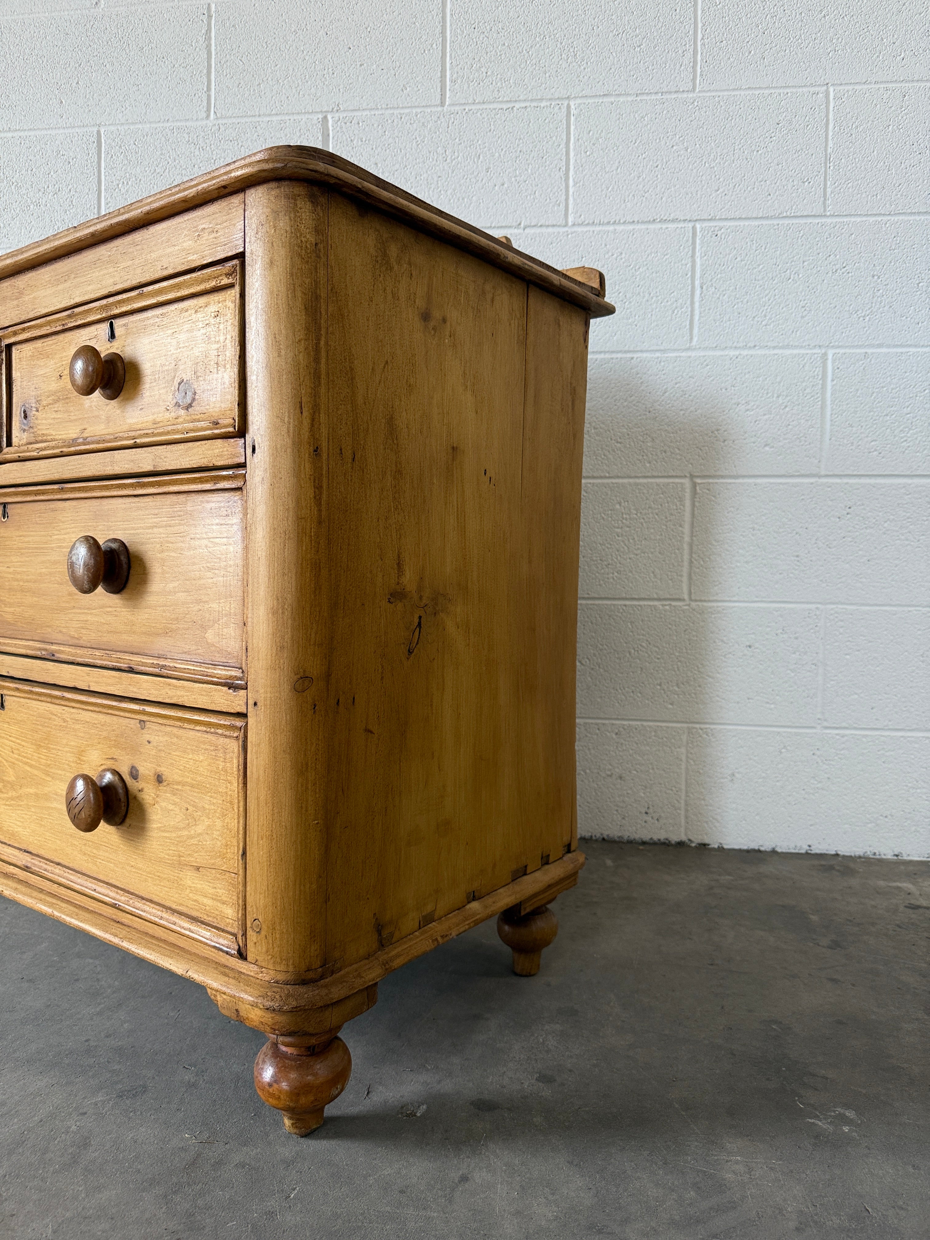 Small antique pine chest of drawers with gallery back