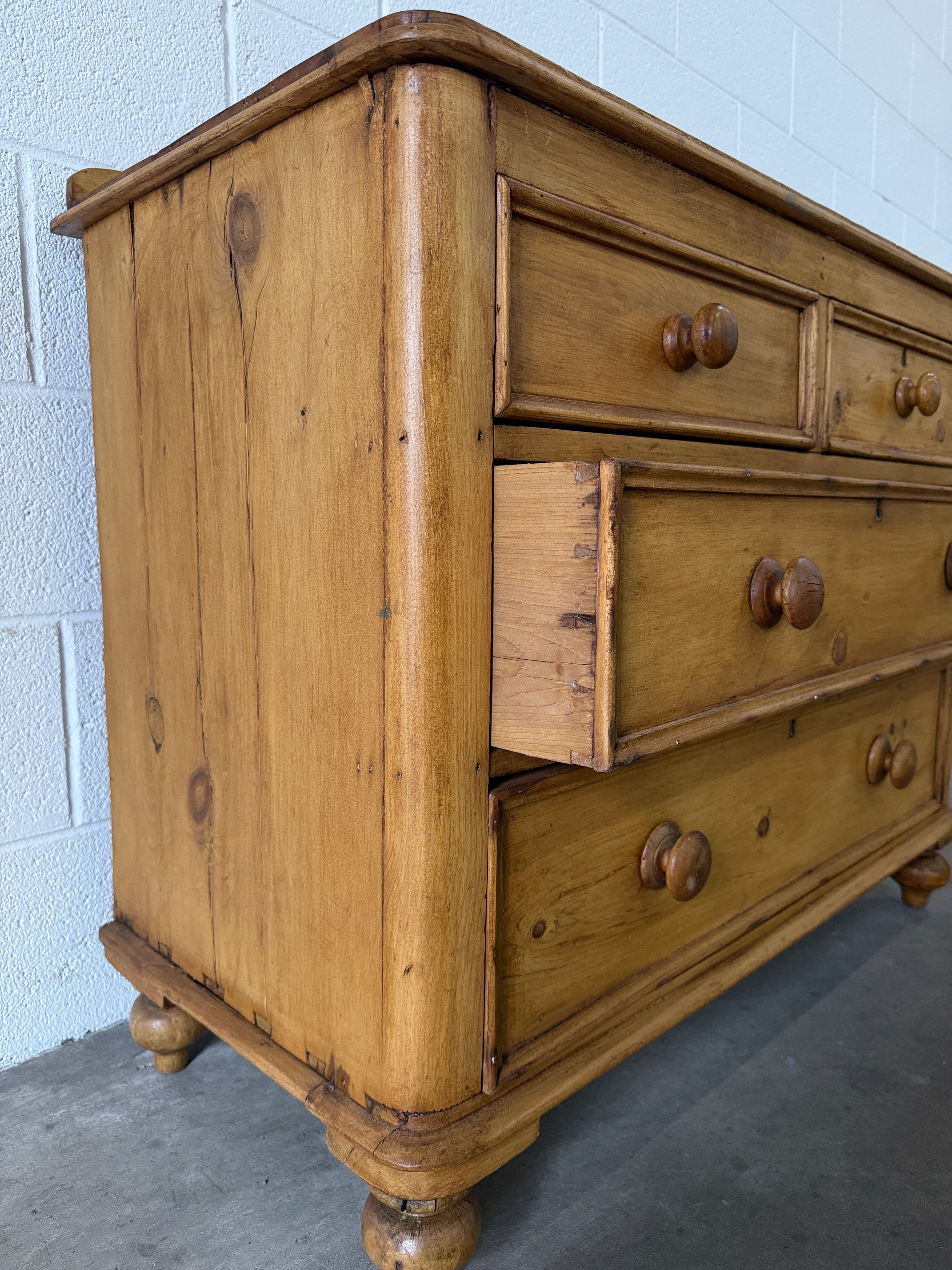 Small antique pine chest of drawers with gallery back