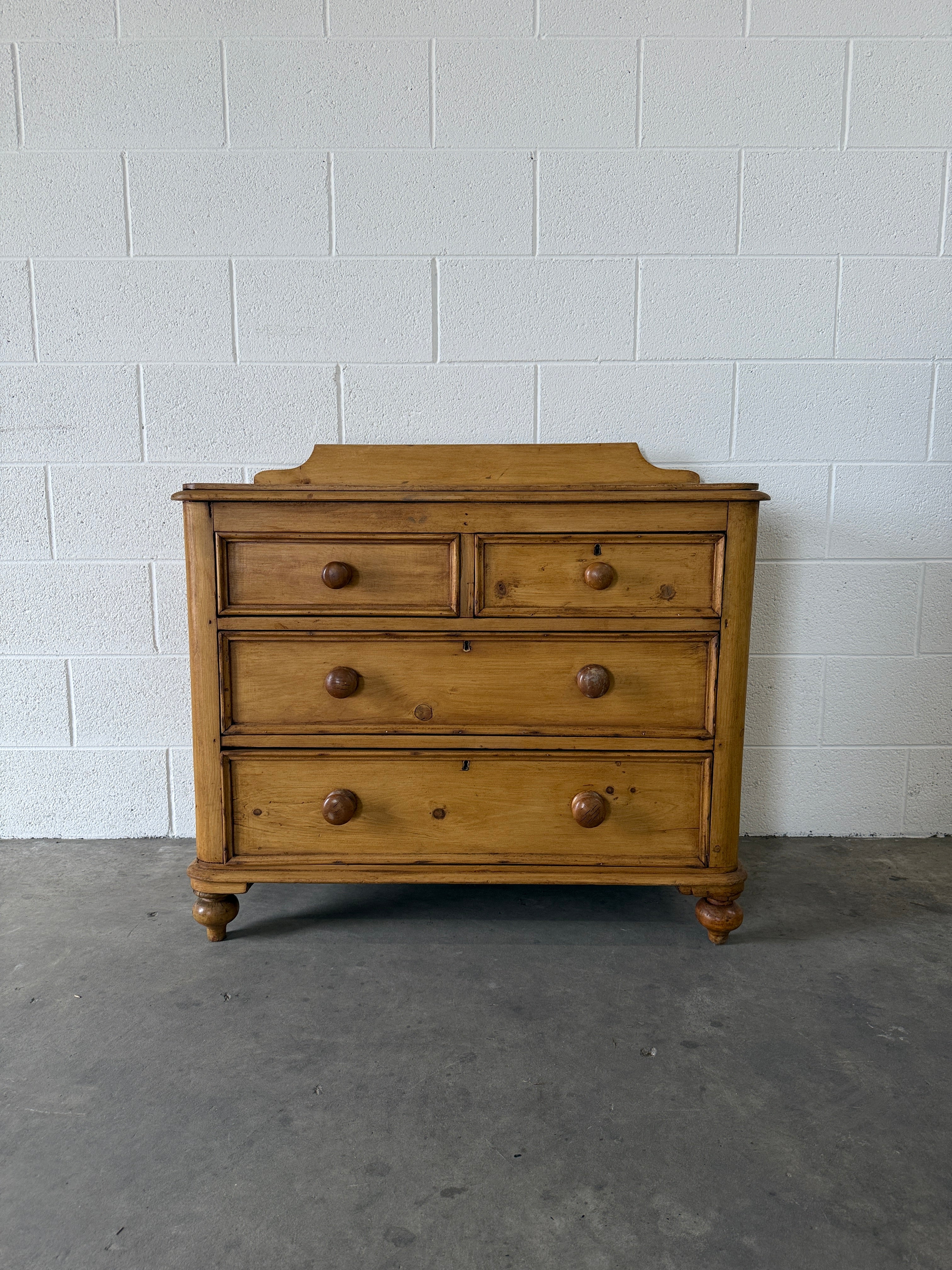 Small antique pine chest of drawers with gallery back
