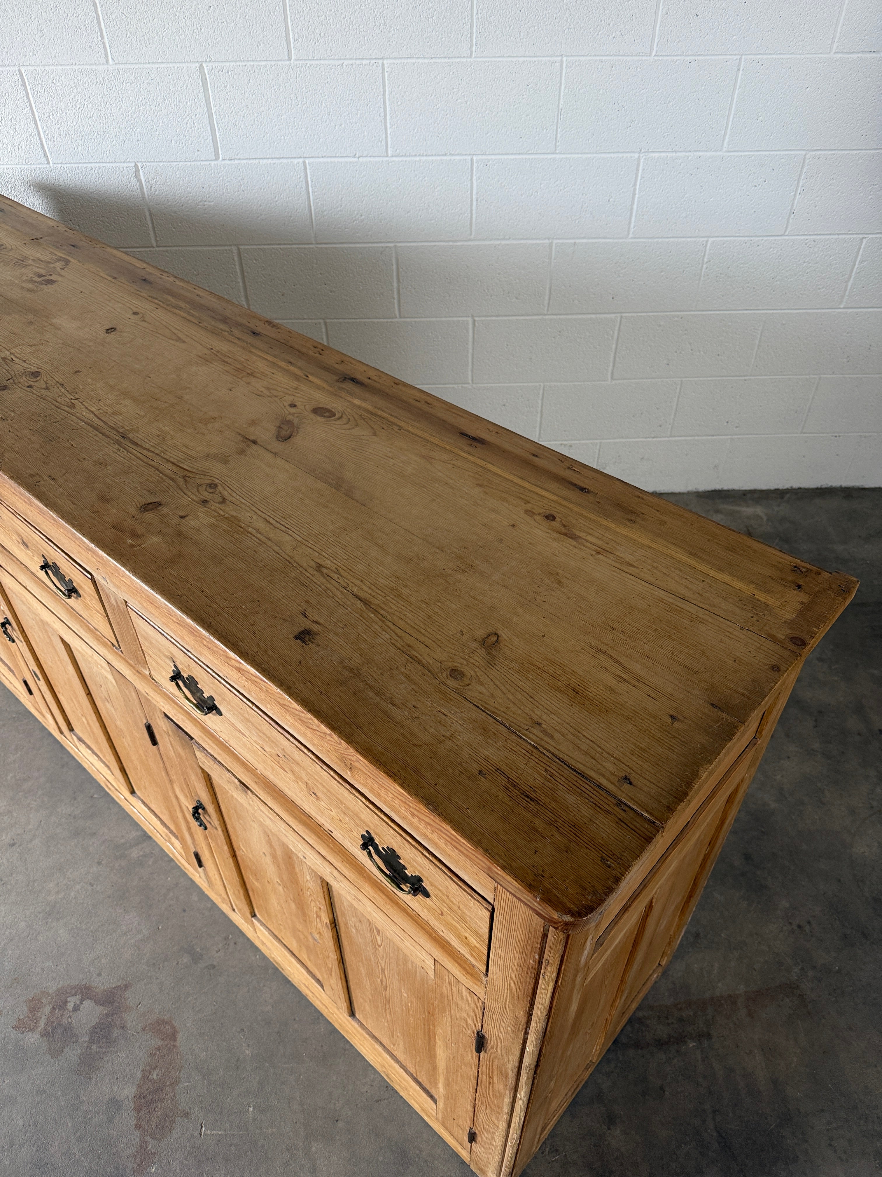 19th‑century English pine sideboard with three drawers and cupboards below