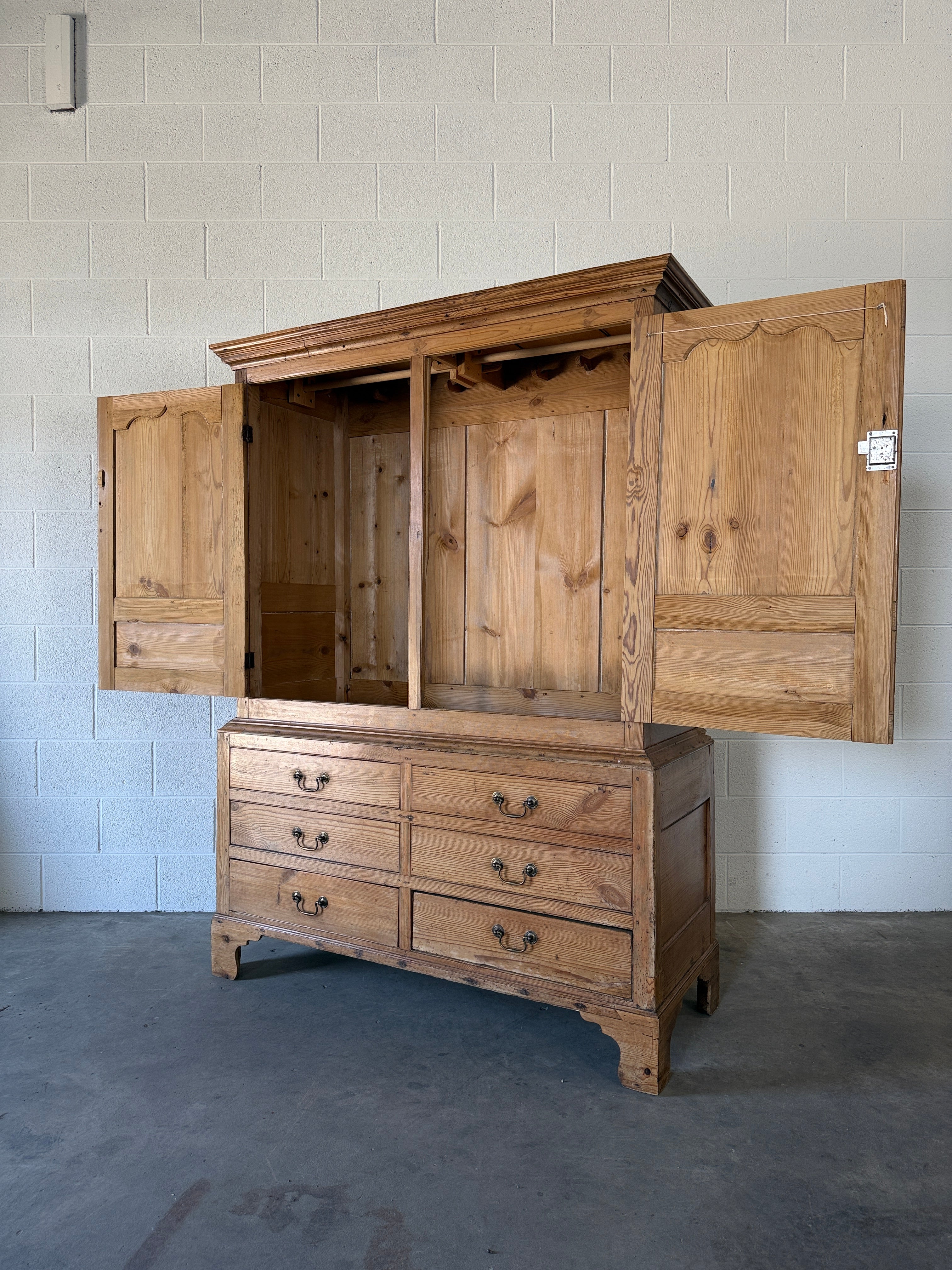 Antique English pine wardrobe with lower drawers