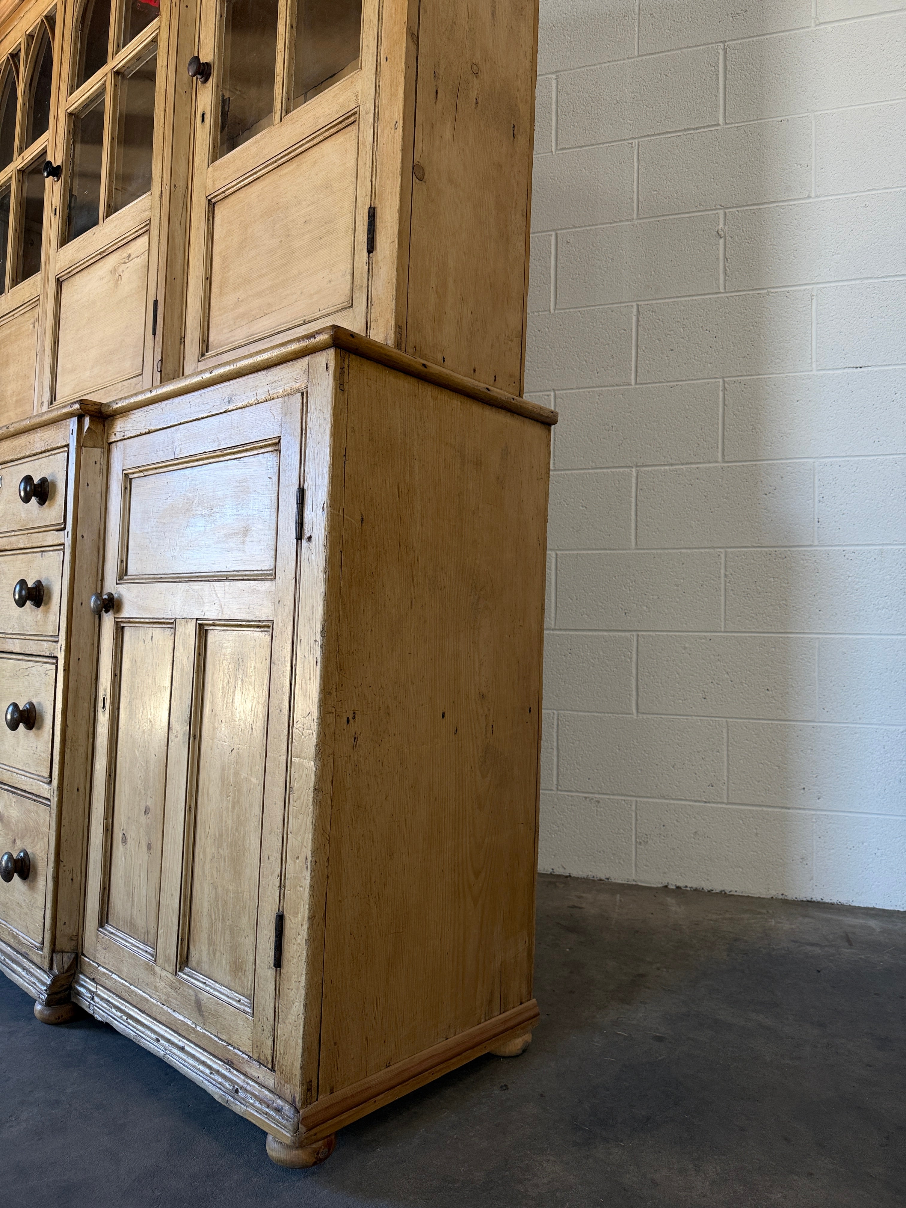 19th‑century English pine cupboard or display case with glass doors