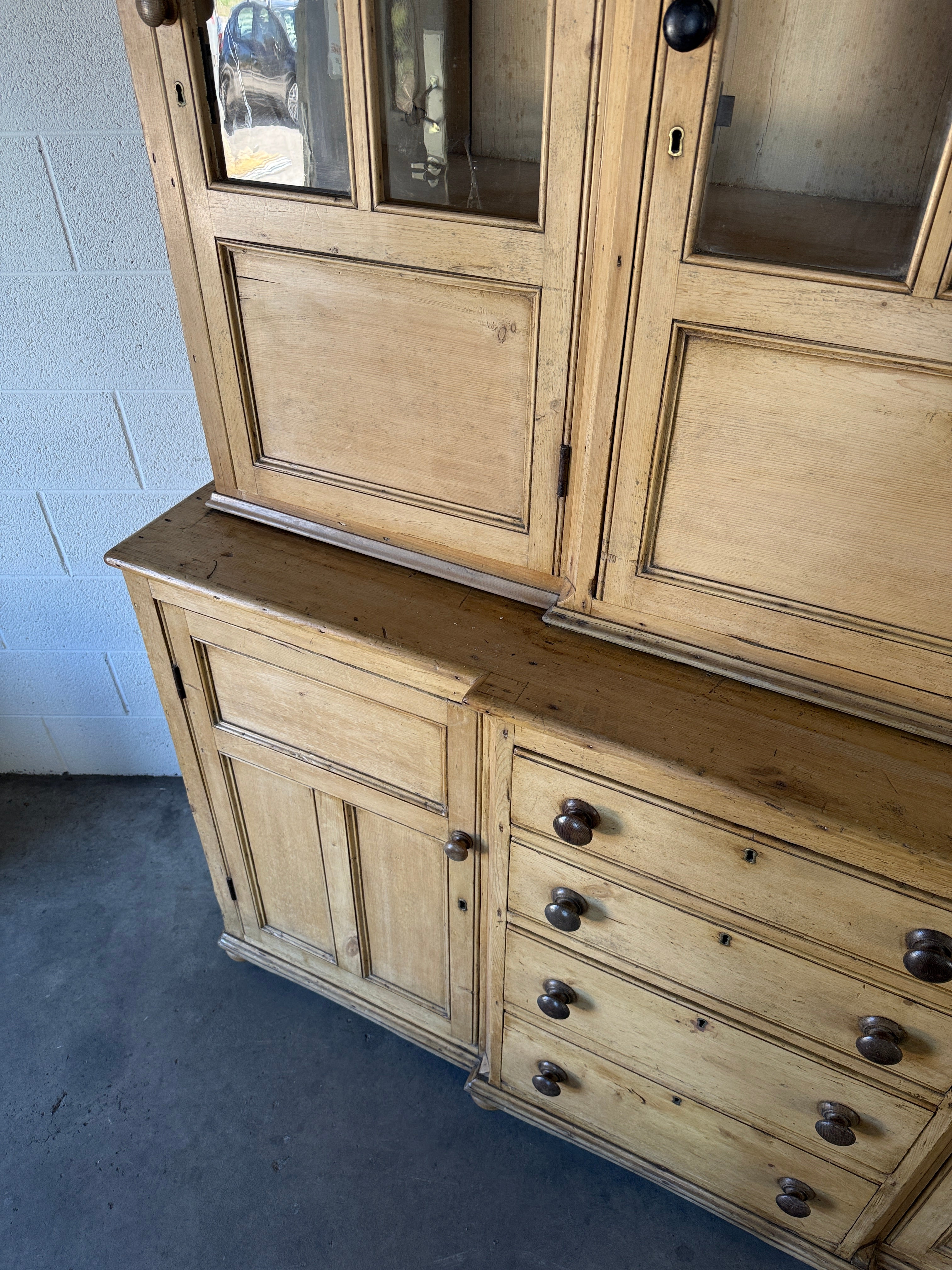 19th‑century English pine cupboard or display case with glass doors