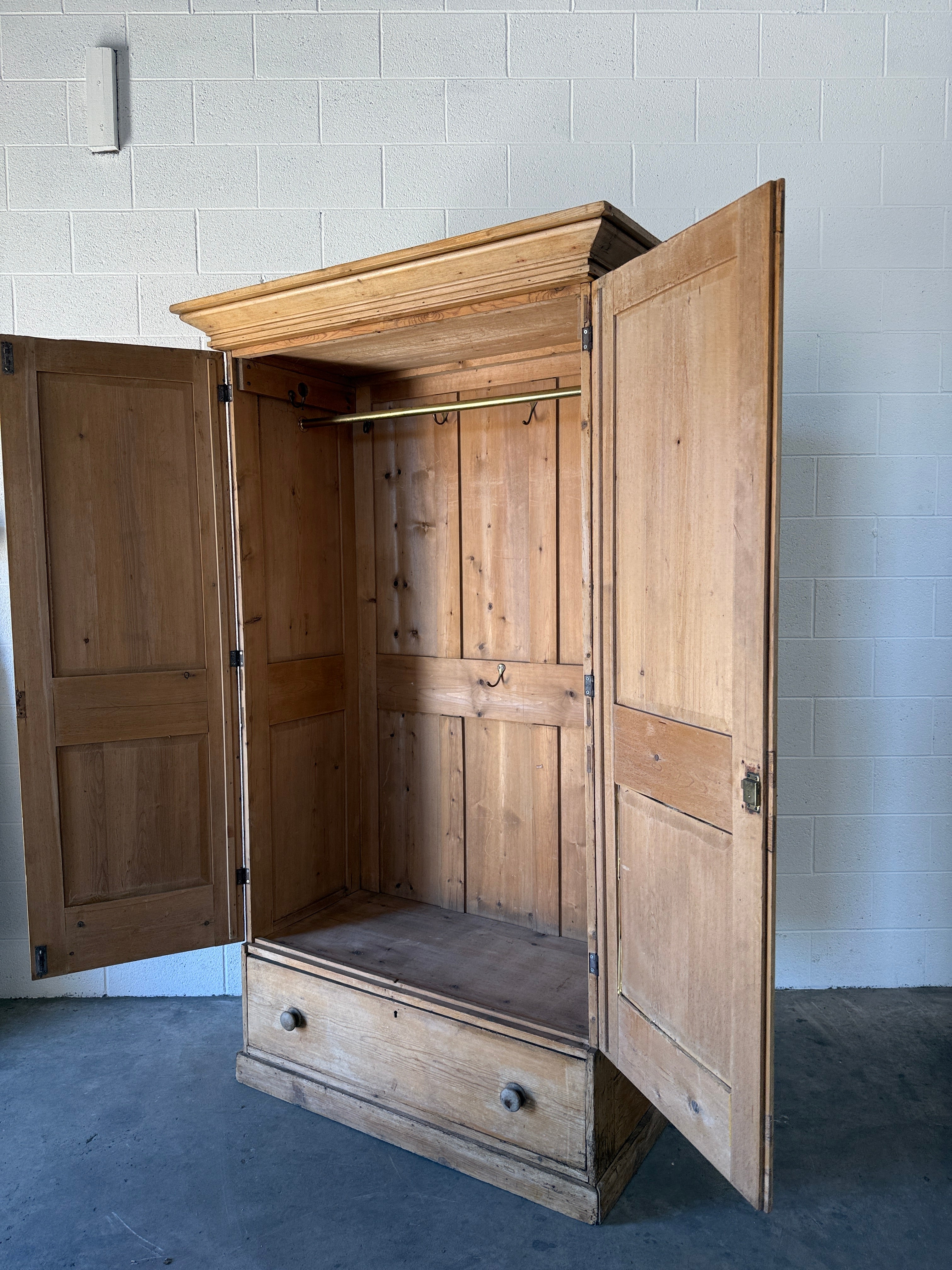 Early–mid 19th‑century English pine wardrobe with base drawer
