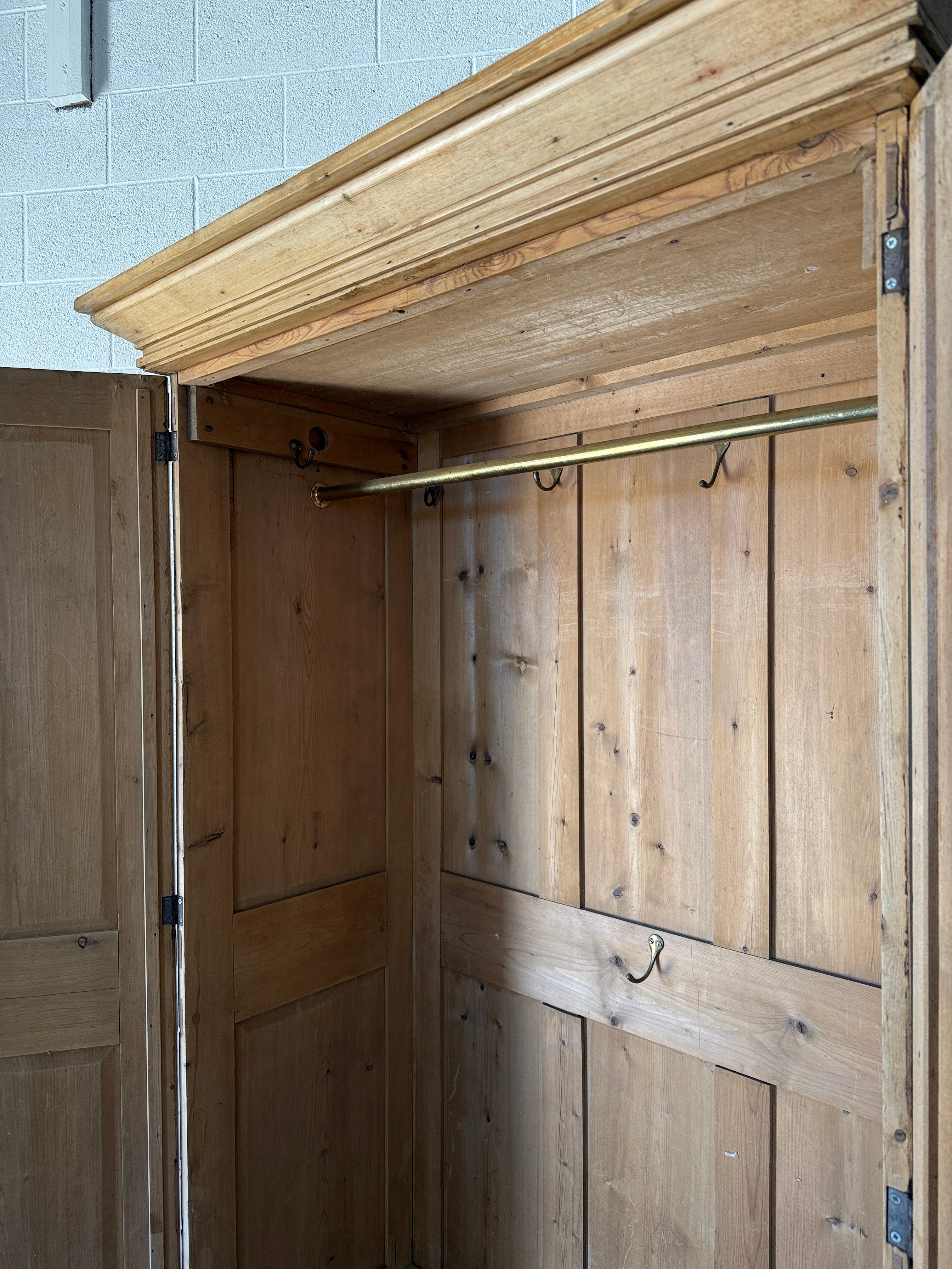 Early–mid 19th‑century English pine wardrobe with base drawer