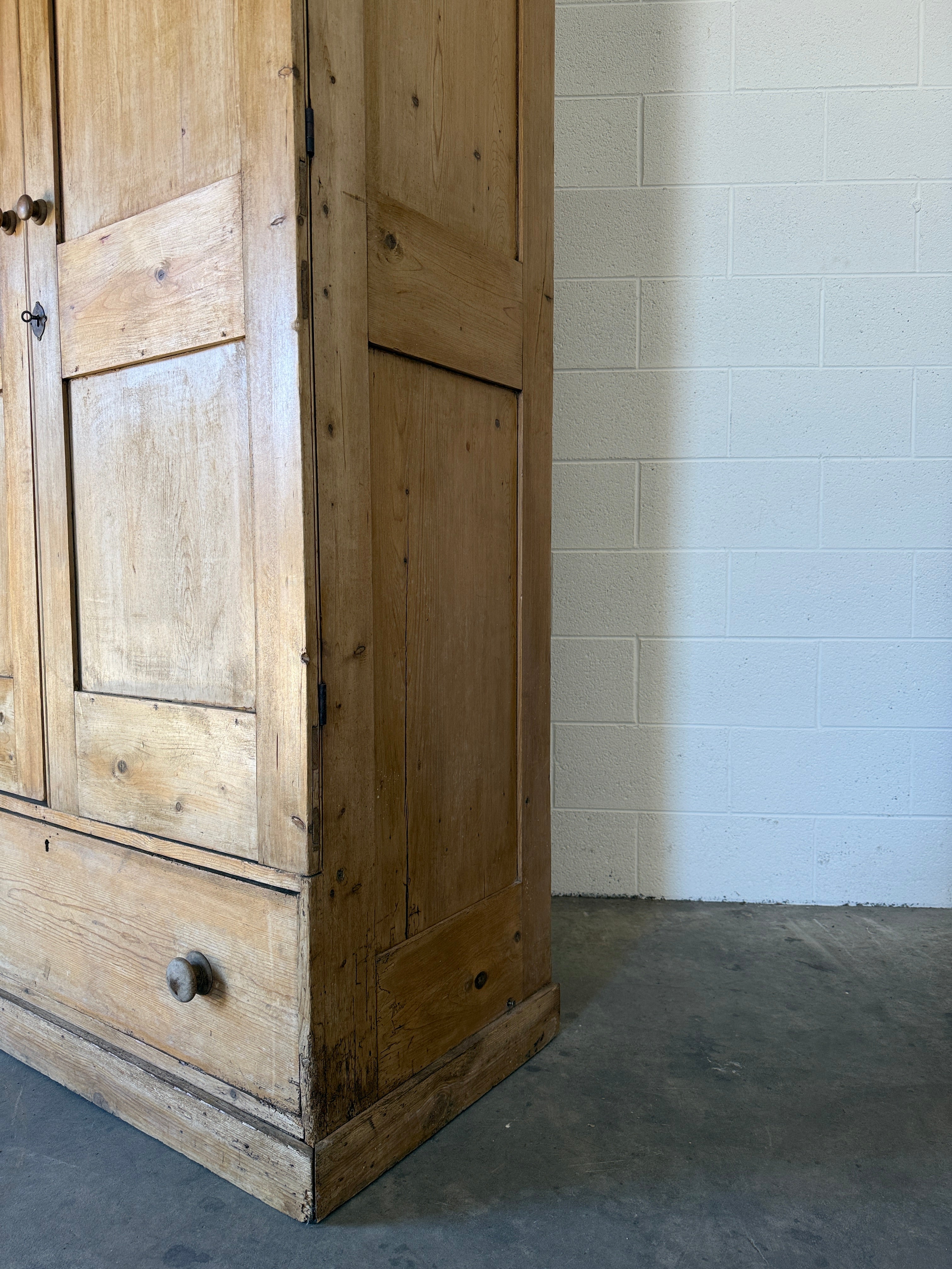 Early–mid 19th‑century English pine wardrobe with base drawer