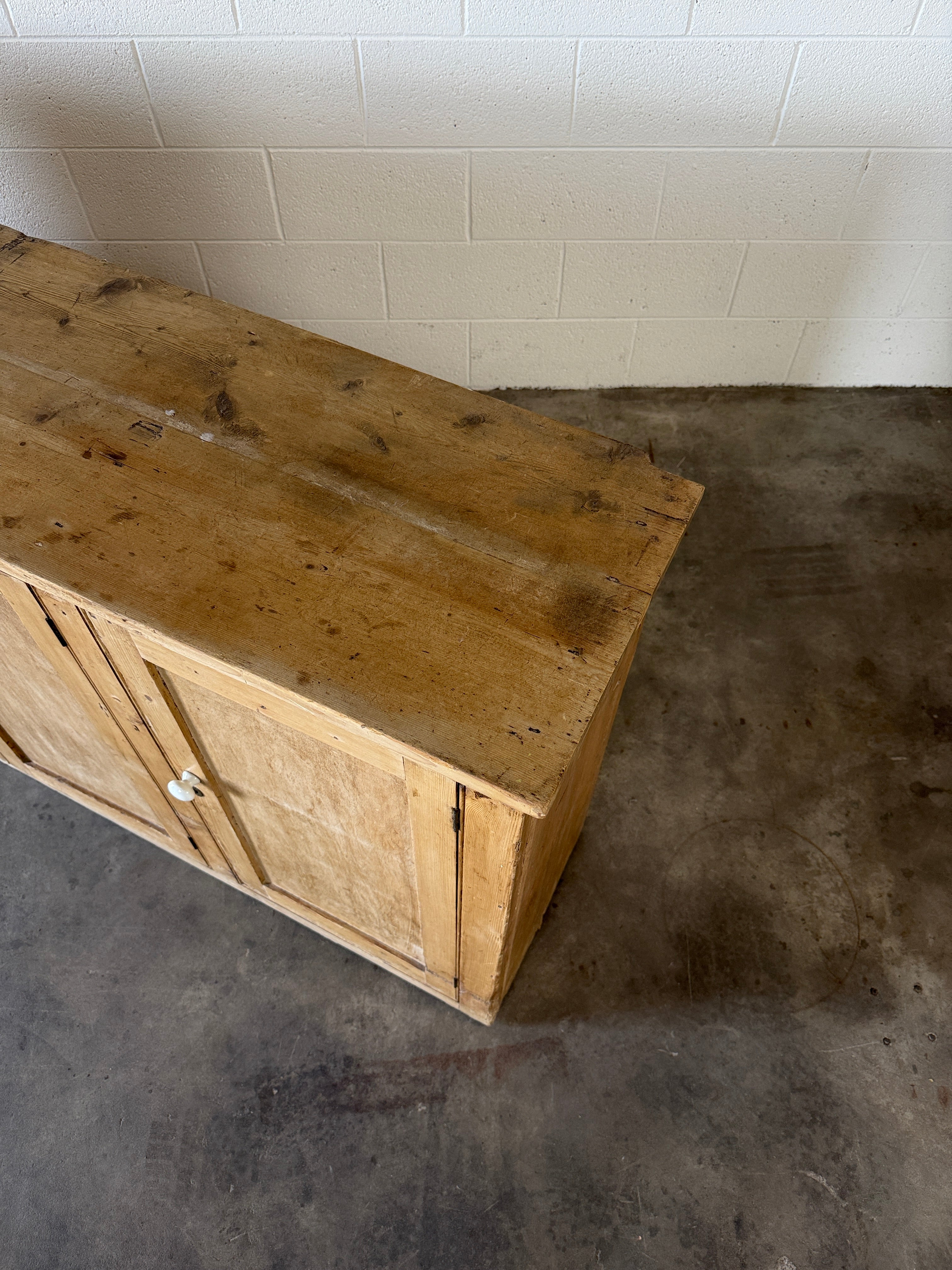 Simple antique pine sideboard with four doors