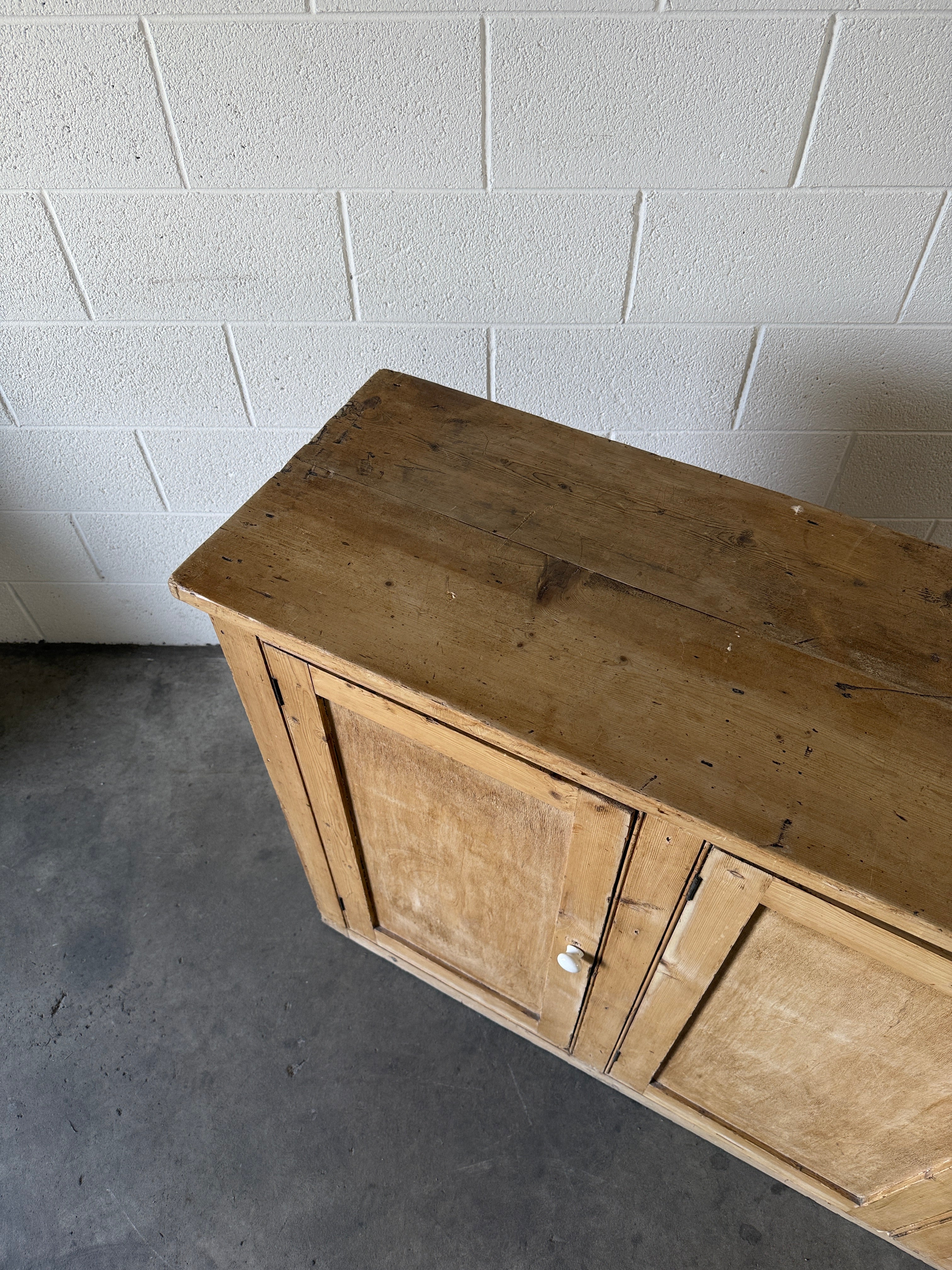 Simple antique pine sideboard with four doors