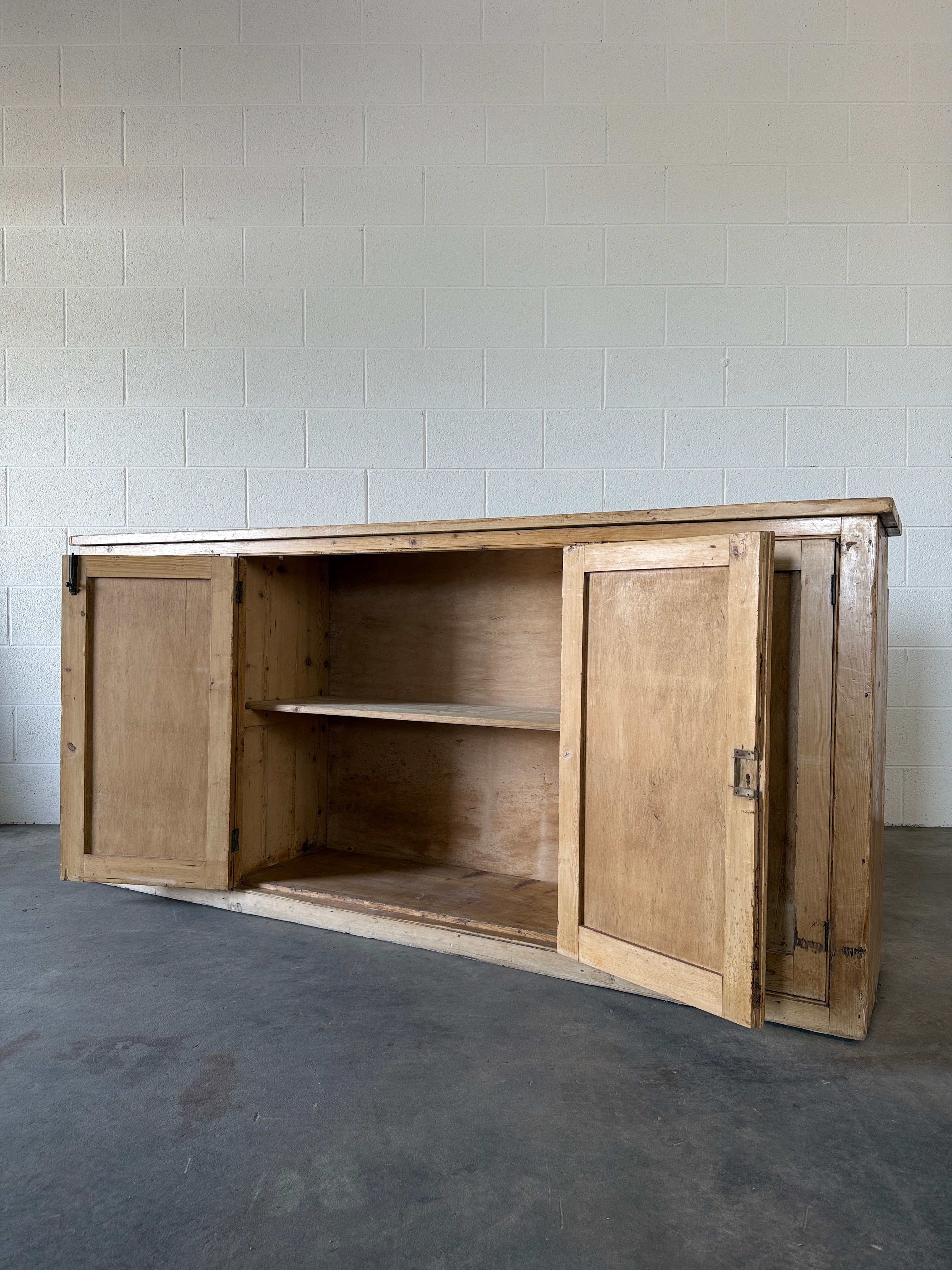 Simple antique pine sideboard with four doors