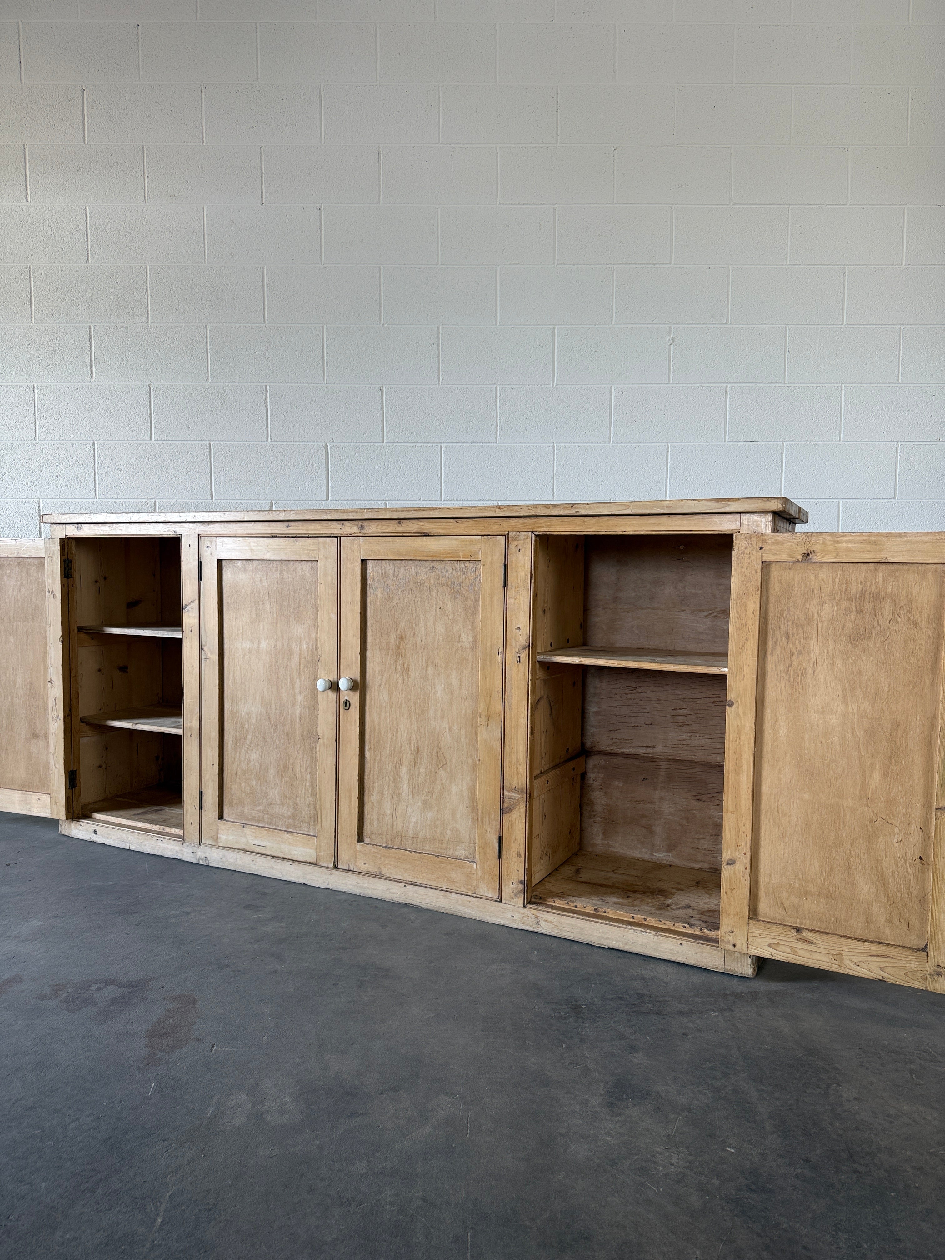 Simple antique pine sideboard with four doors