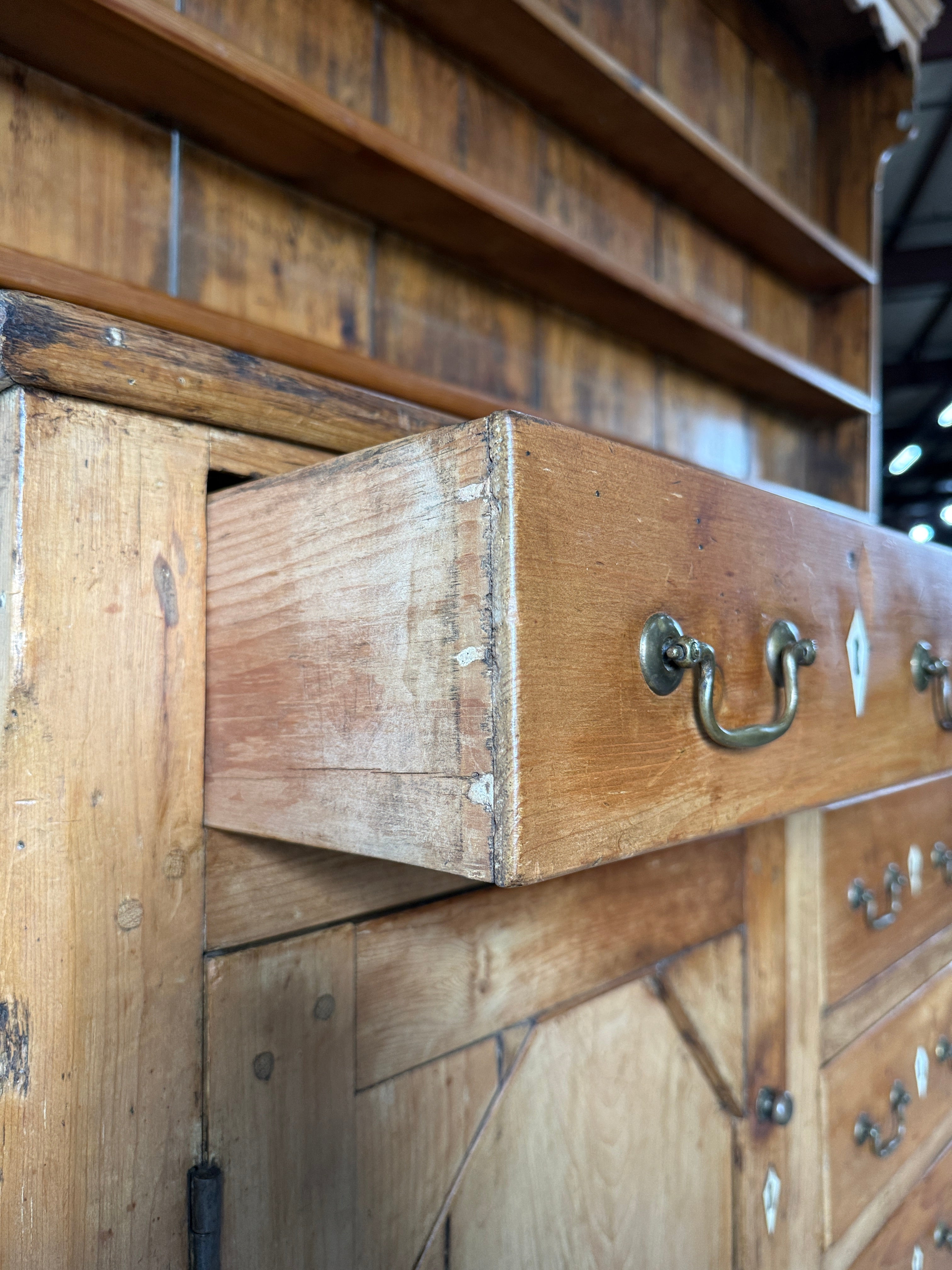 Antique English pine kitchen dresser with paneled doors and detailed trim work