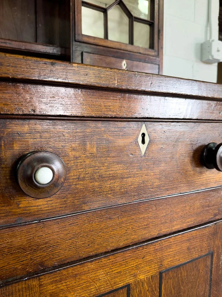 Antique English oak kitchen dresser with scalloped detail