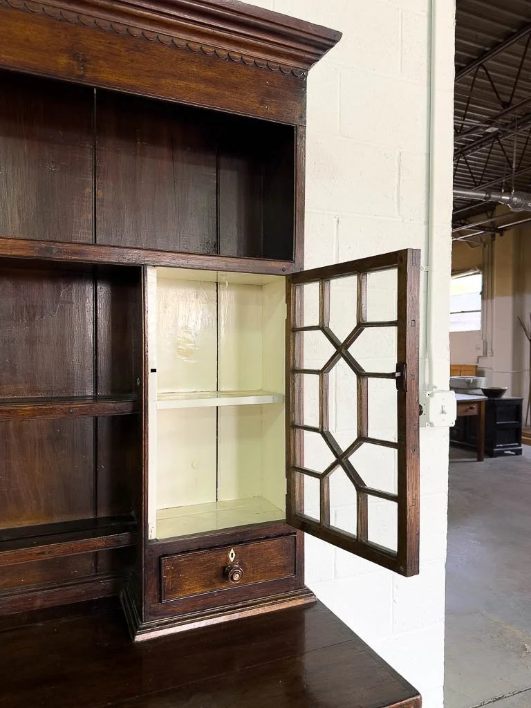 Antique English oak kitchen dresser with scalloped detail