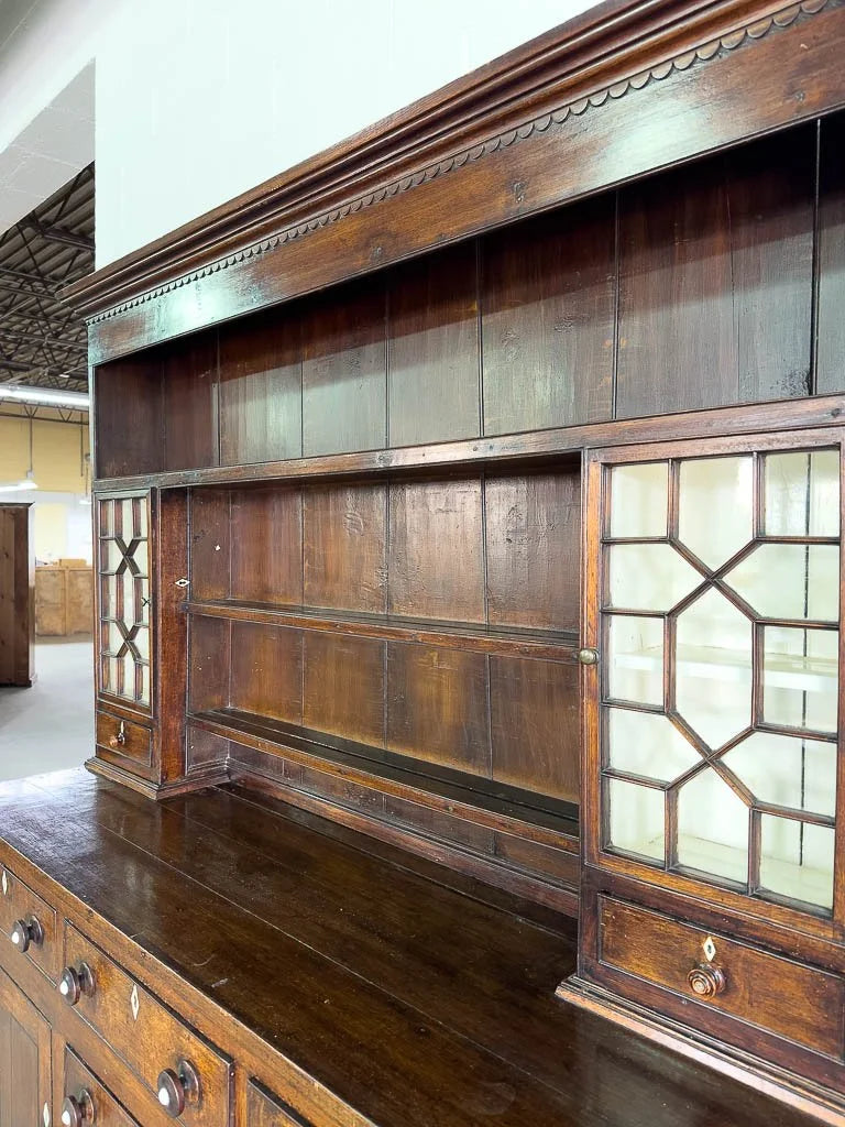 Antique English oak kitchen dresser with scalloped detail