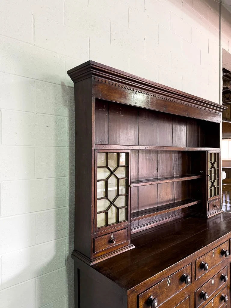 Antique English oak kitchen dresser with scalloped detail