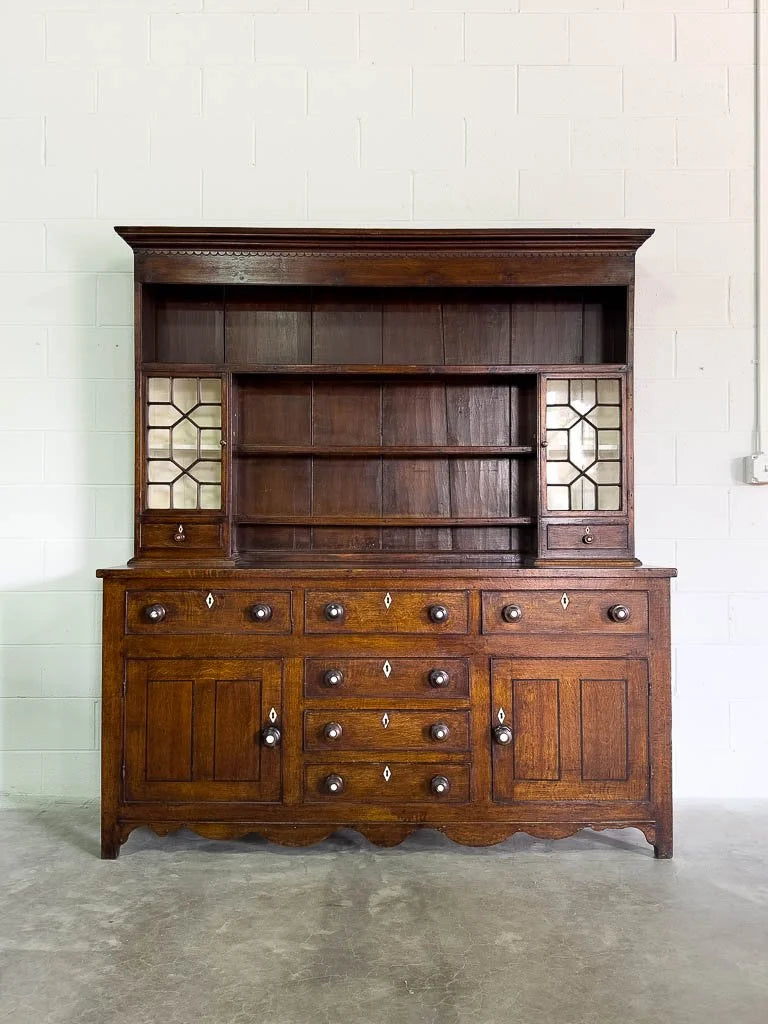 Antique English oak kitchen dresser with scalloped detail