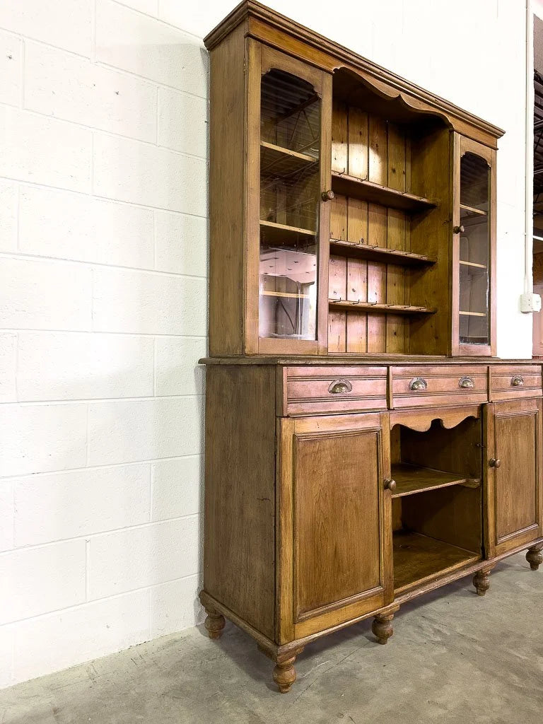 Antique European hutch with glass doors and a plate rack