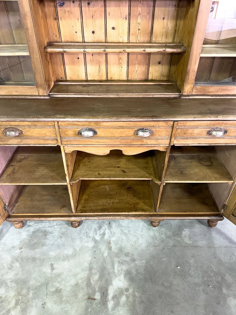 Antique European hutch with glass doors and a plate rack