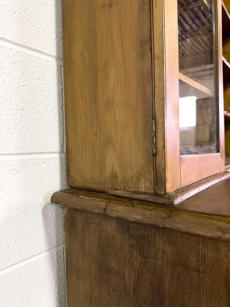 Antique European hutch with glass doors and a plate rack