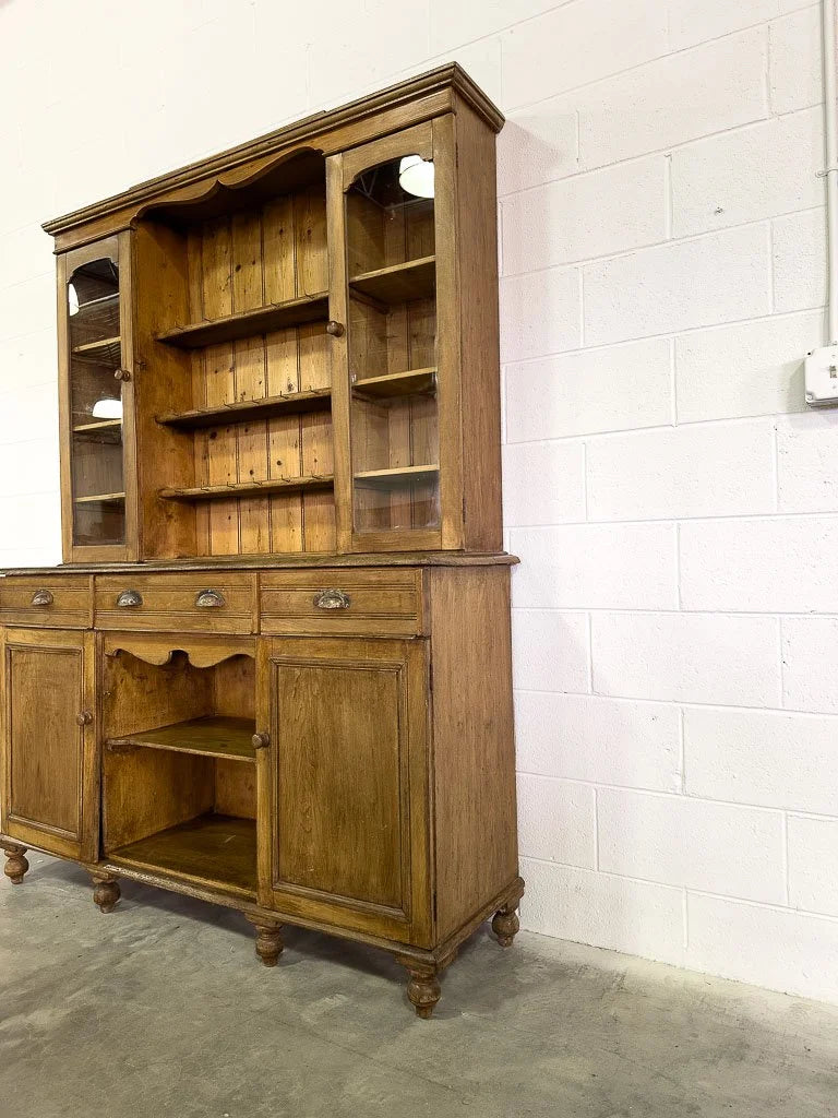 Antique European hutch with glass doors and a plate rack