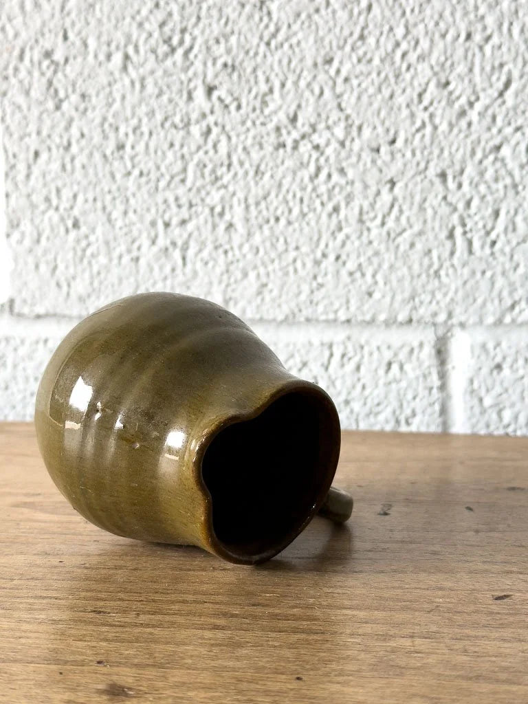 Small green stoneware creamer