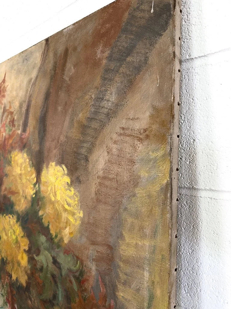 Large antique painting of flowers in a vase