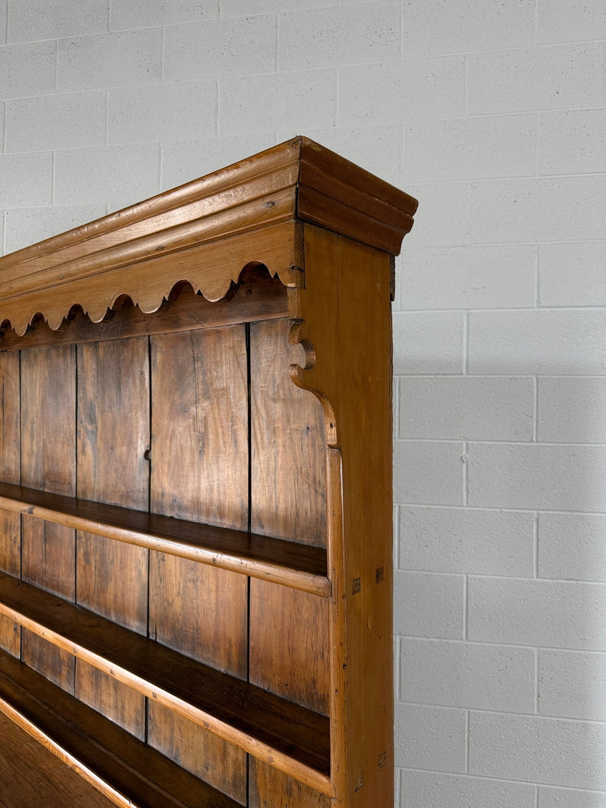 Antique English pine kitchen dresser with paneled doors and detailed trim work - House on Horizon