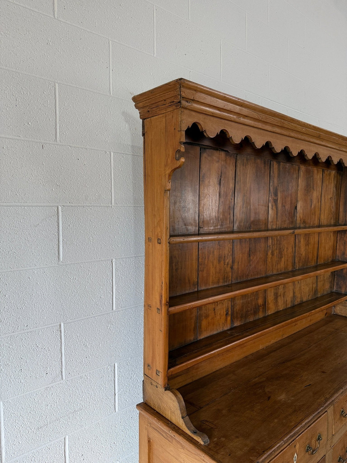 Antique English pine kitchen dresser with paneled doors and detailed trim work - House on Horizon