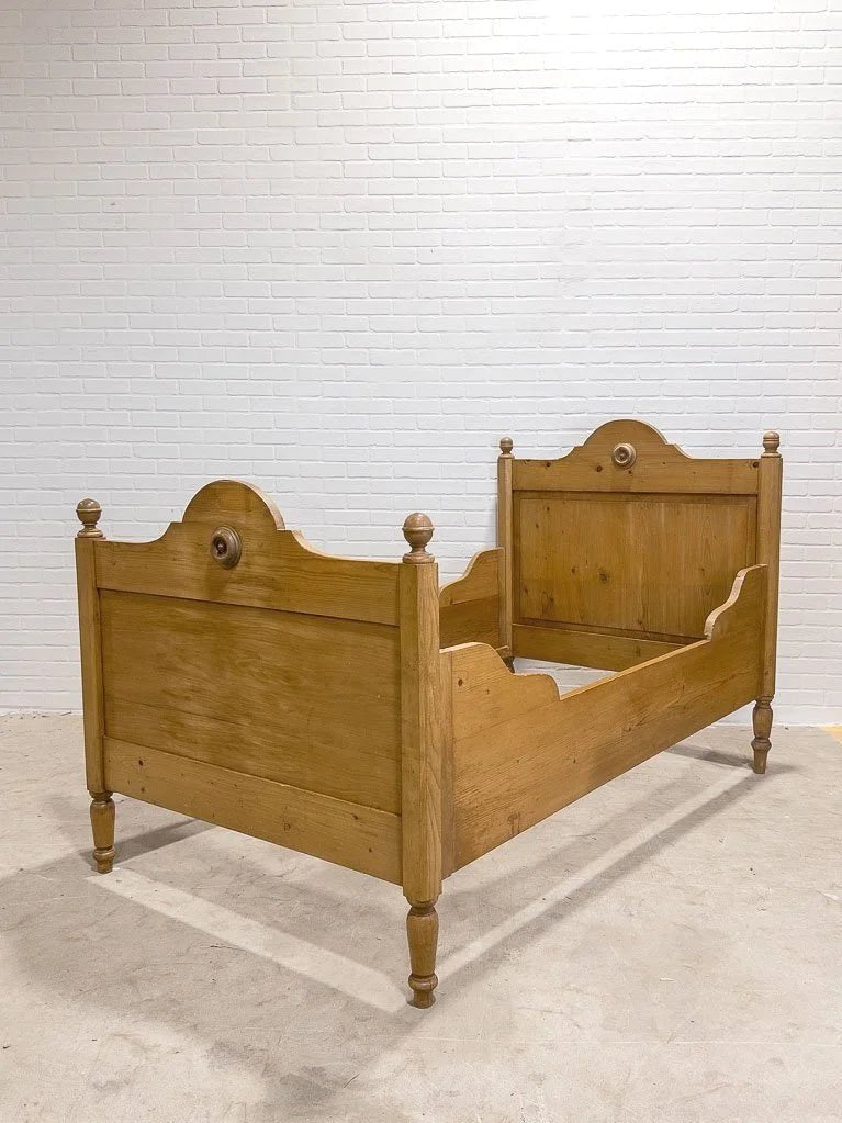 Antique English pine sleigh bed with turned rosette - House on Horizon