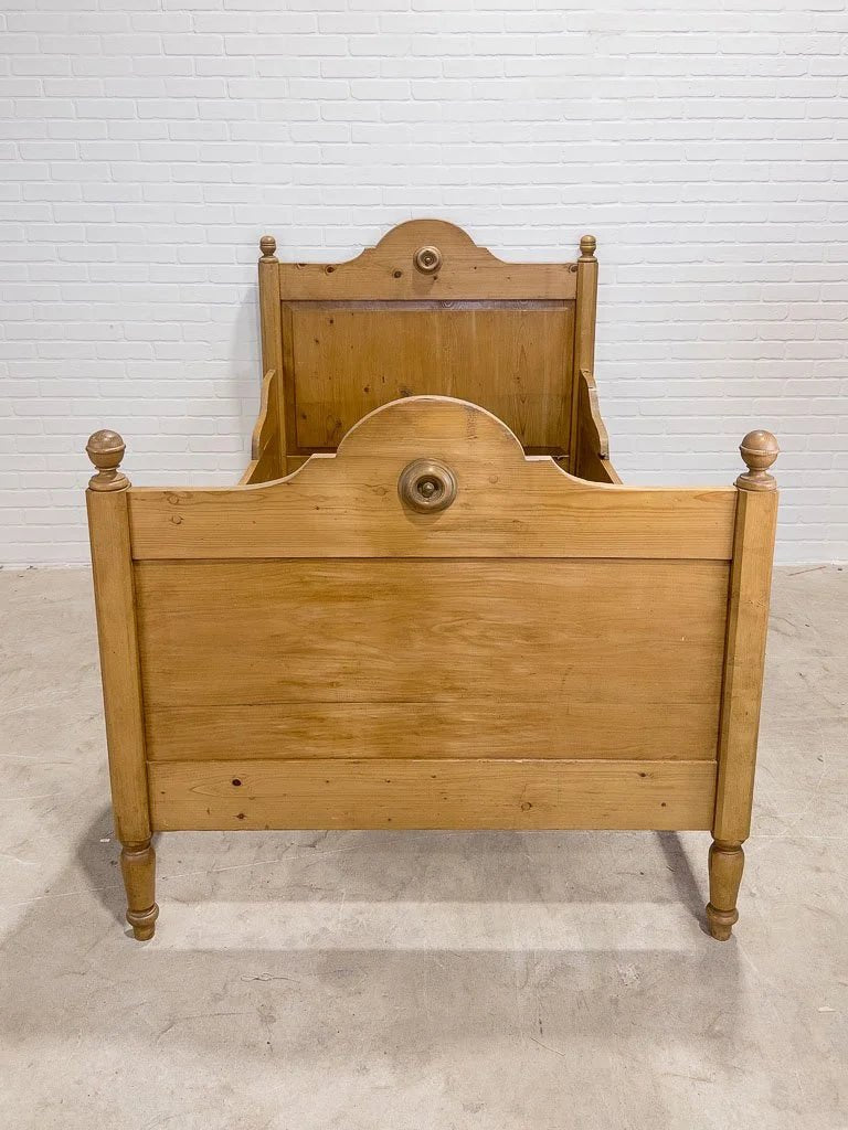 Antique English pine sleigh bed with turned rosette - House on Horizon