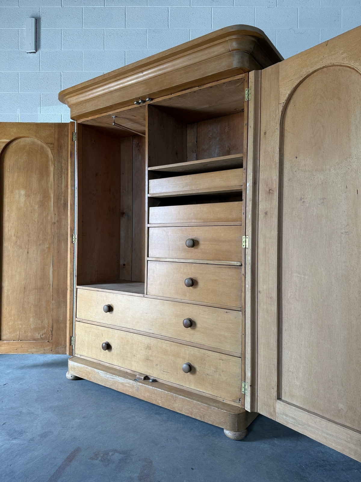 Antique English pine wardrobe with arched panel doors and fitted interior - House on Horizon